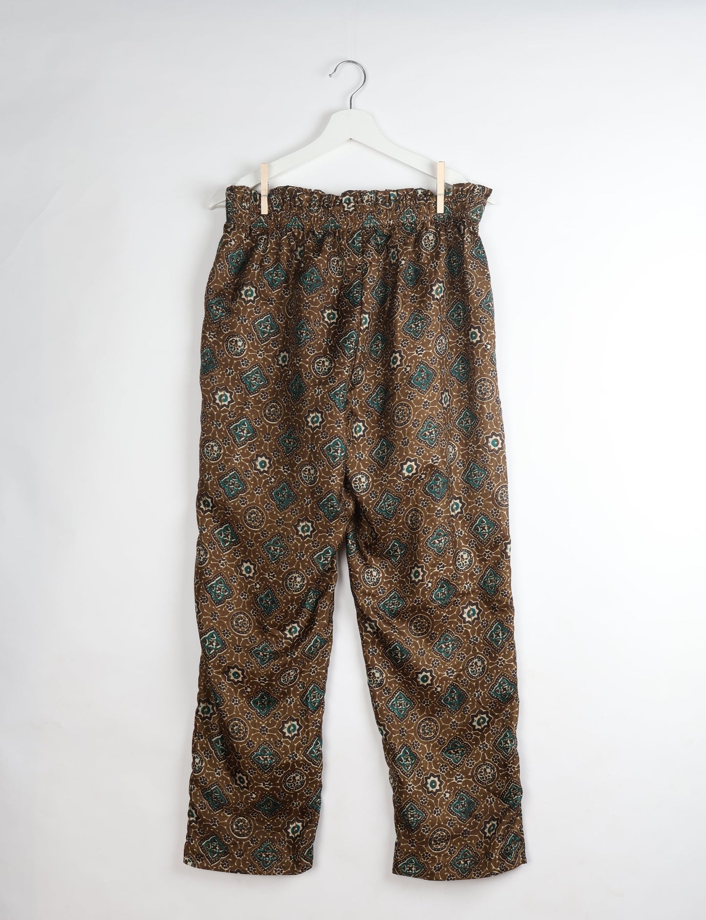 Paperbag high waisted pull-on pants for women made from upcycled garments and recycled fabric, featuring eco clothing design with an elasticated waistband and side pockets. A beautiful example of sustainable women’s clothing and environmentally friendly clothing inspired by upcycling fashion and green fashion movements.