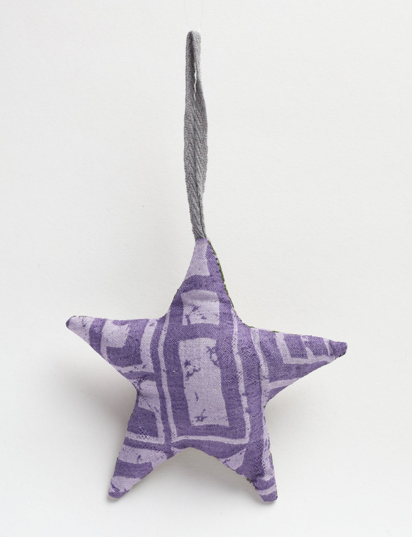 Hand-stitched mini star bauble made from recycled sari products, showcasing upcycled clothing techniques and eco friendly fashion. A lightweight festive accessory promoting conscious clothing, organic clothing, and sustainable women’s clothing crafted from recycled material clothing.