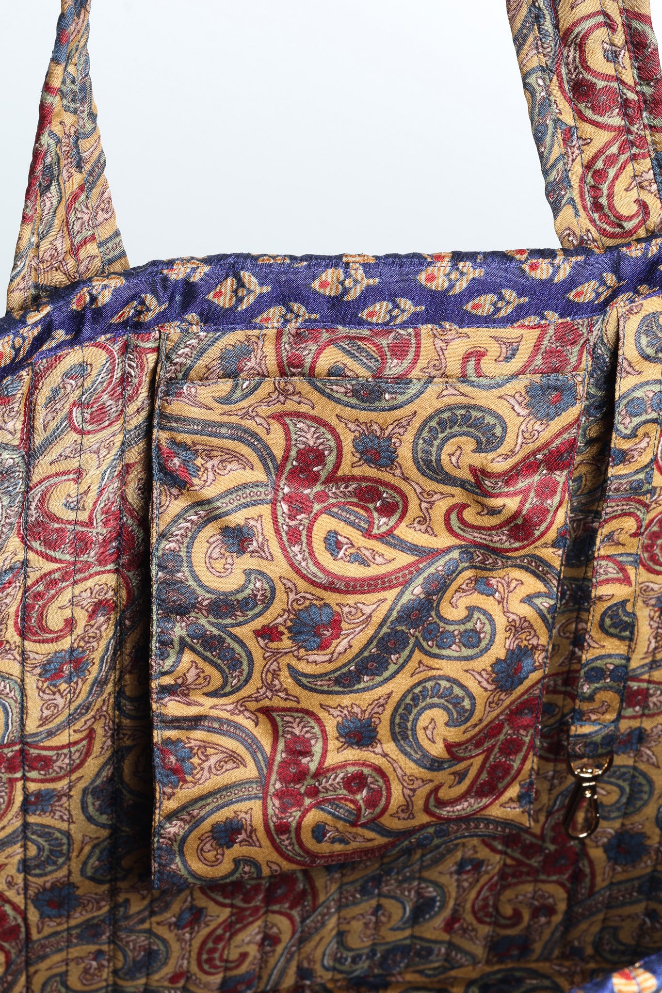 Quilted work tote bag with structured rectangular design and long shoulder straps, representing slow fashion and ethical clothing ideals, made as part of upcycled women's clothing and sustainable women's clothing using recycled fashion and earth friendly clothing practices.