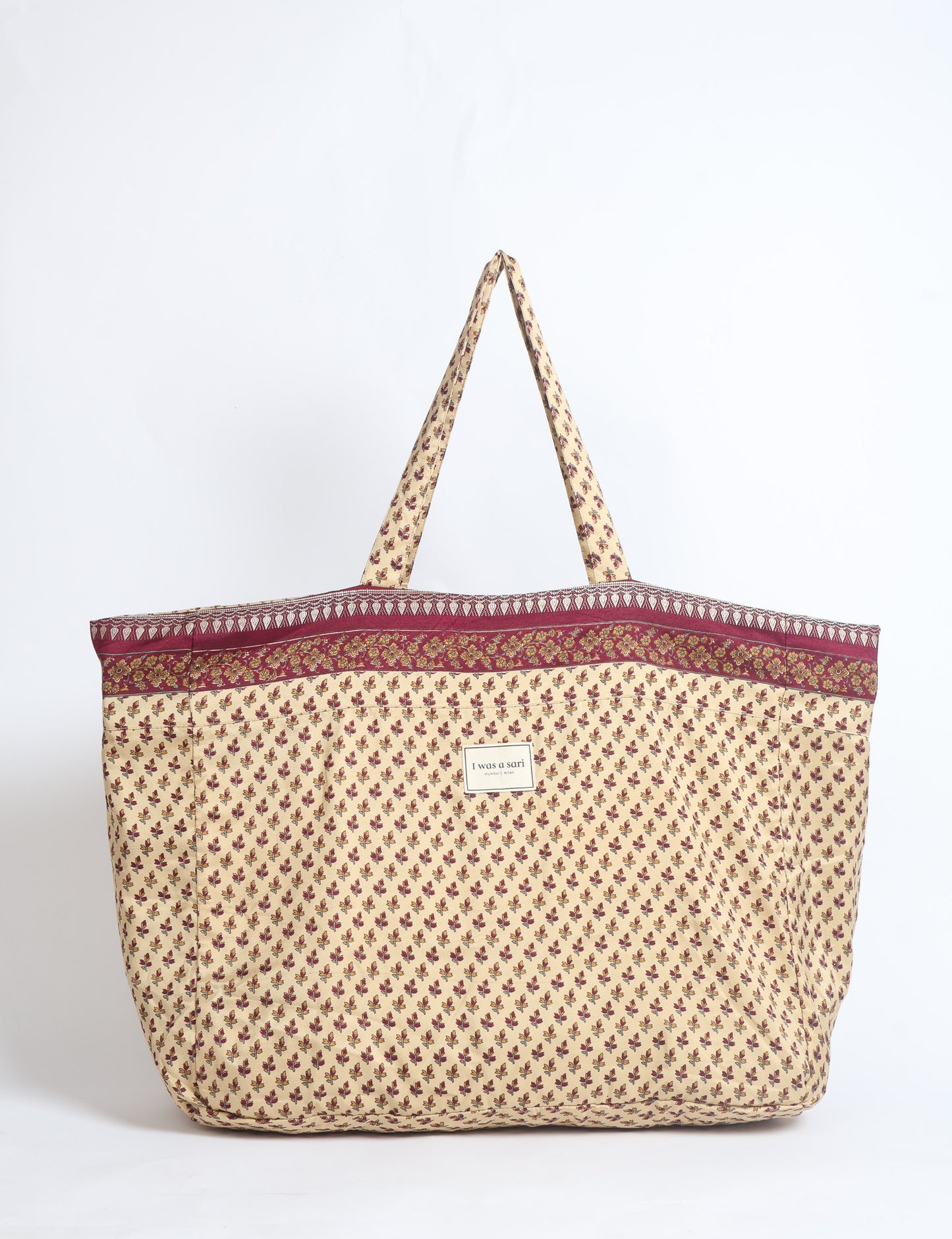 Large beach bag with a spacious rectangular design, wide top opening, and comfortable shoulder handles for carrying daily and travel essentials.