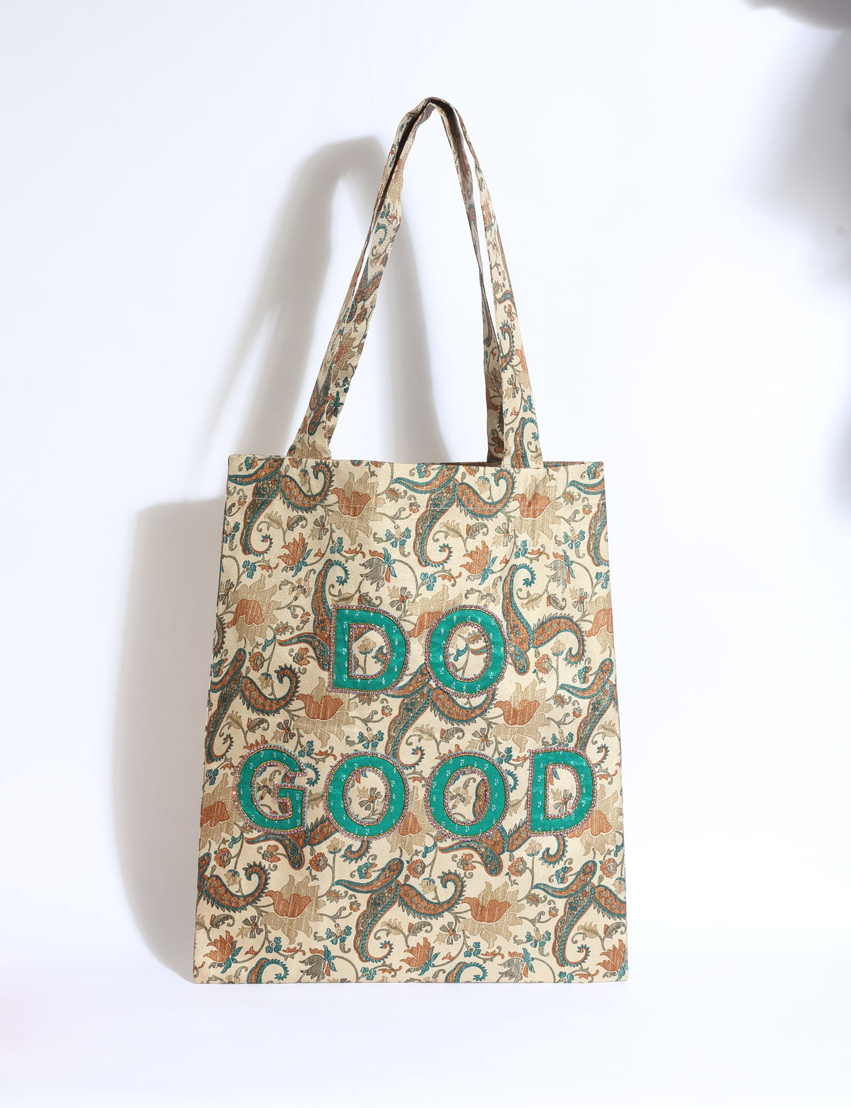 DO GOOD tote bag featuring contrasting sari fabric appliqué lettering, double shoulder straps, soft construction and an internal slip pocket with piping detail.