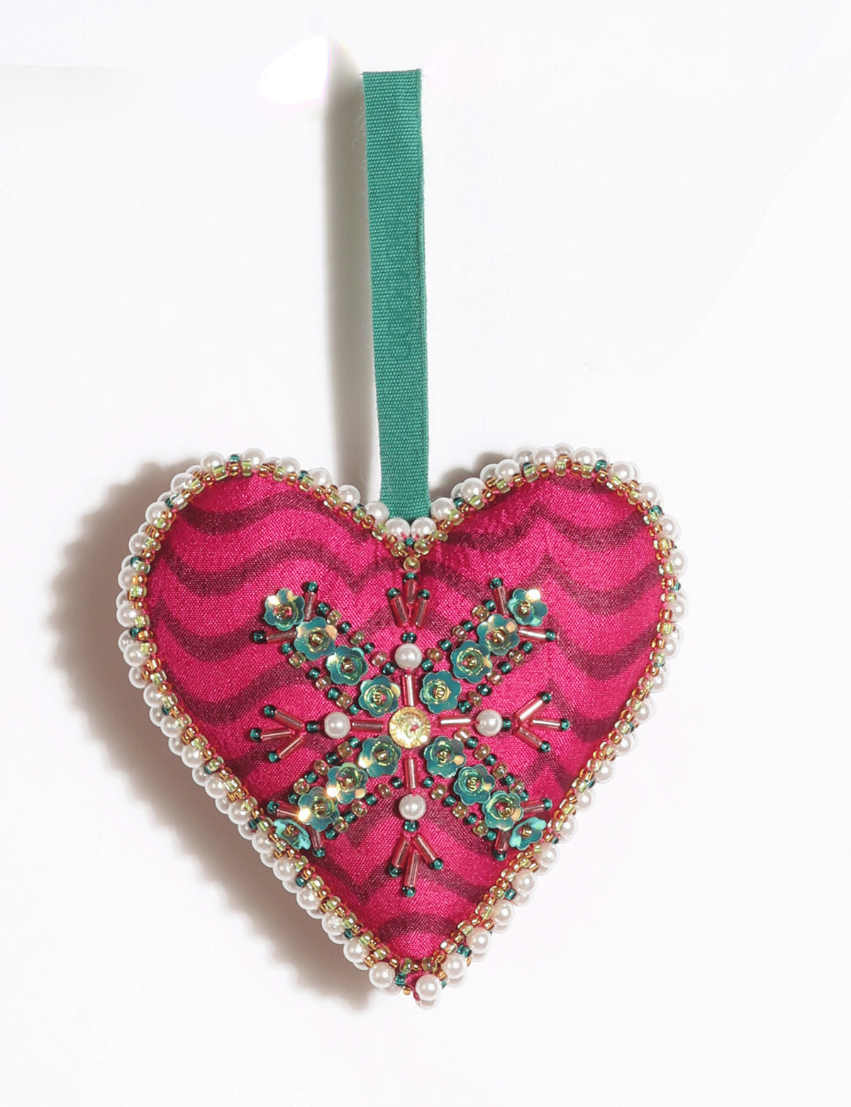 Cheer heart-shaped festive ornament made from vibrant upcycled saris with hand-embroidered Aari work, beads, sequins, and pearls.