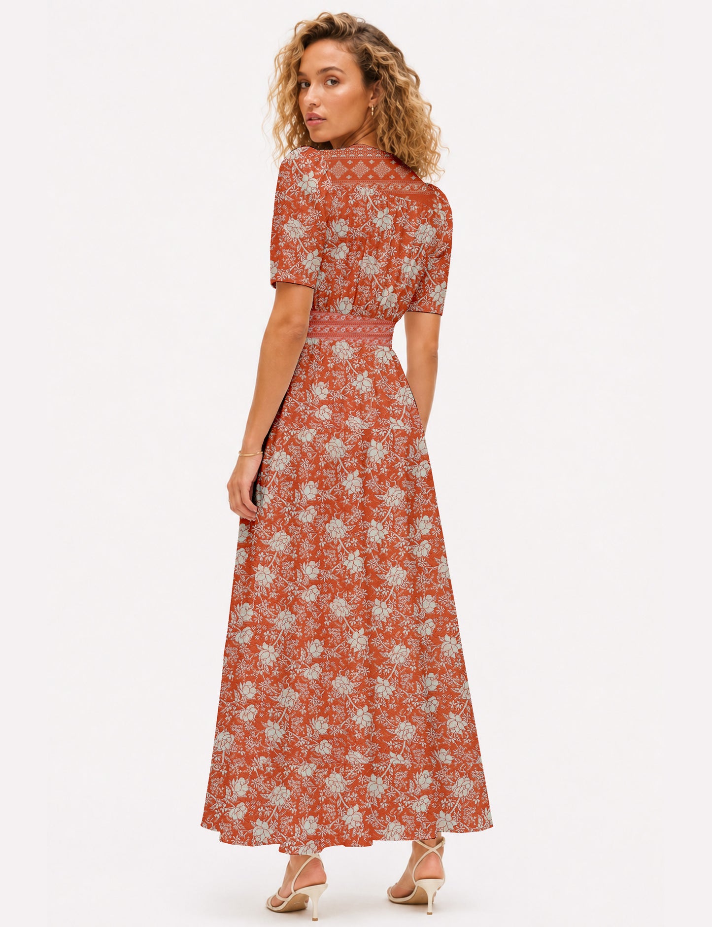 Maxi romantic dress with a fitted bodice, V-neckline, functional button placket, structured waist panel, short sleeves, and a softly flared ankle-length A-line skirt.