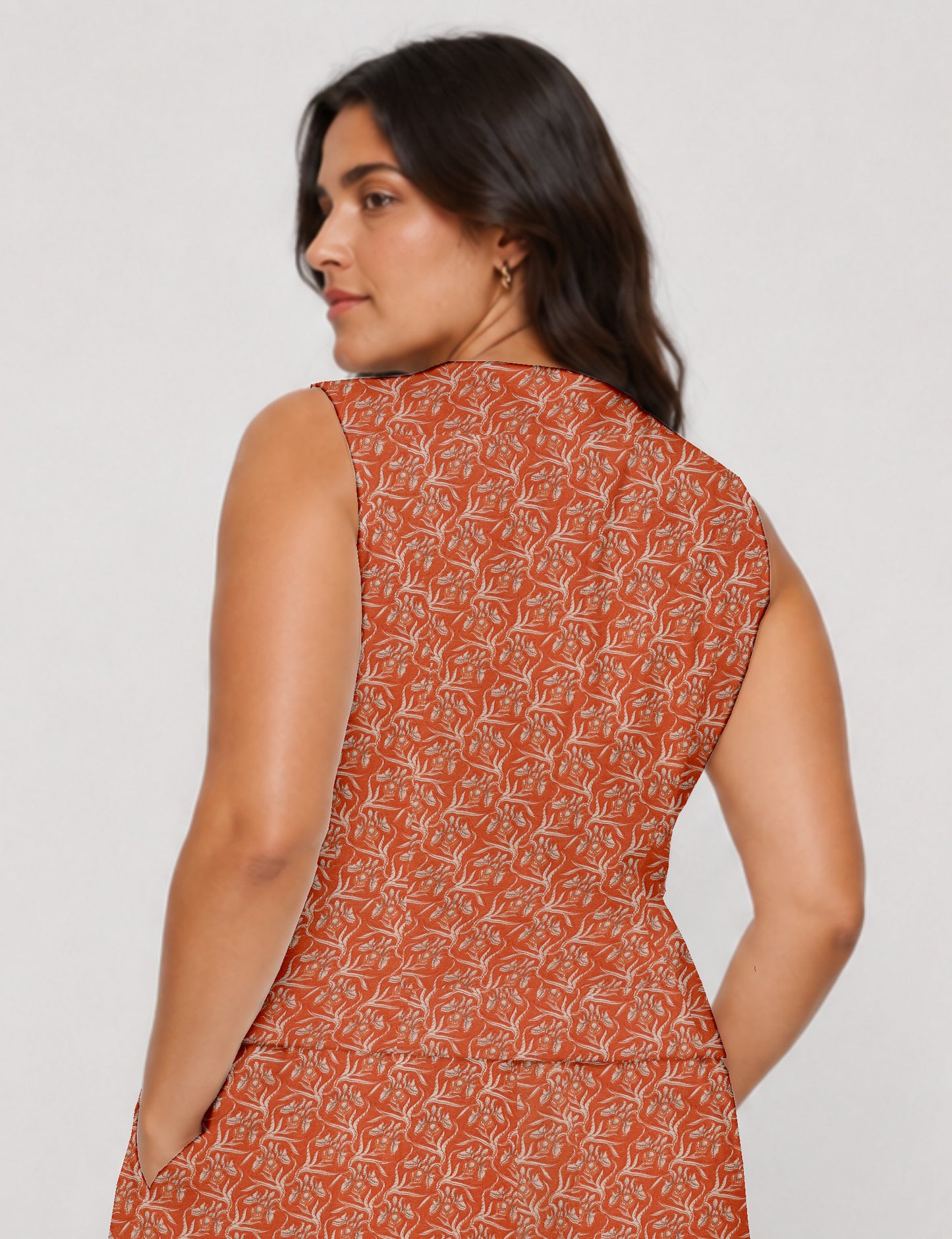 Women's fitted waistcoat with V-neck, single-breasted button closure, tailored silhouette, and pointed hem in sustainable fashion.