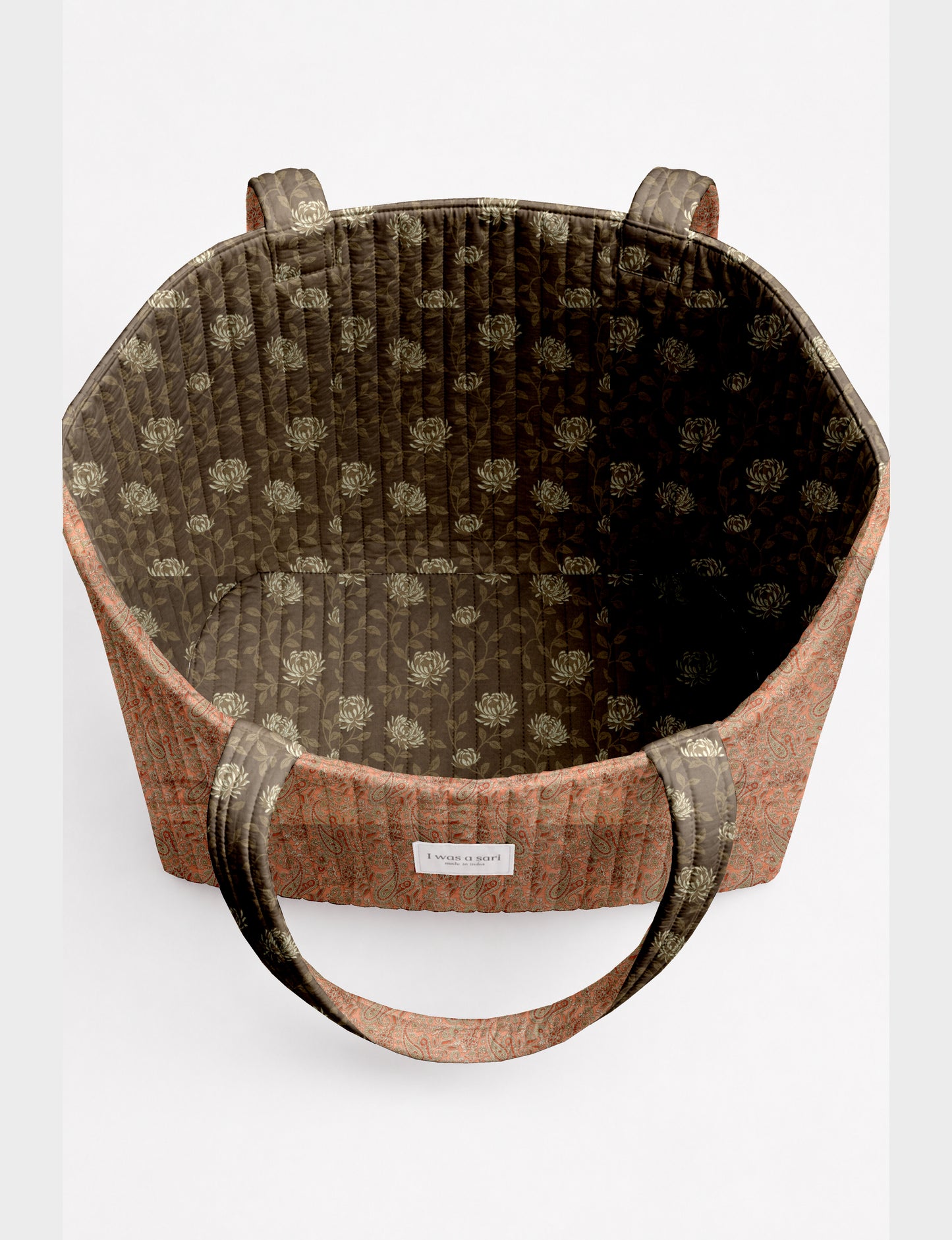 Large quilted beach bag with spacious rectangular design, reinforced shoulder straps, and open-top construction for everyday use and travel.