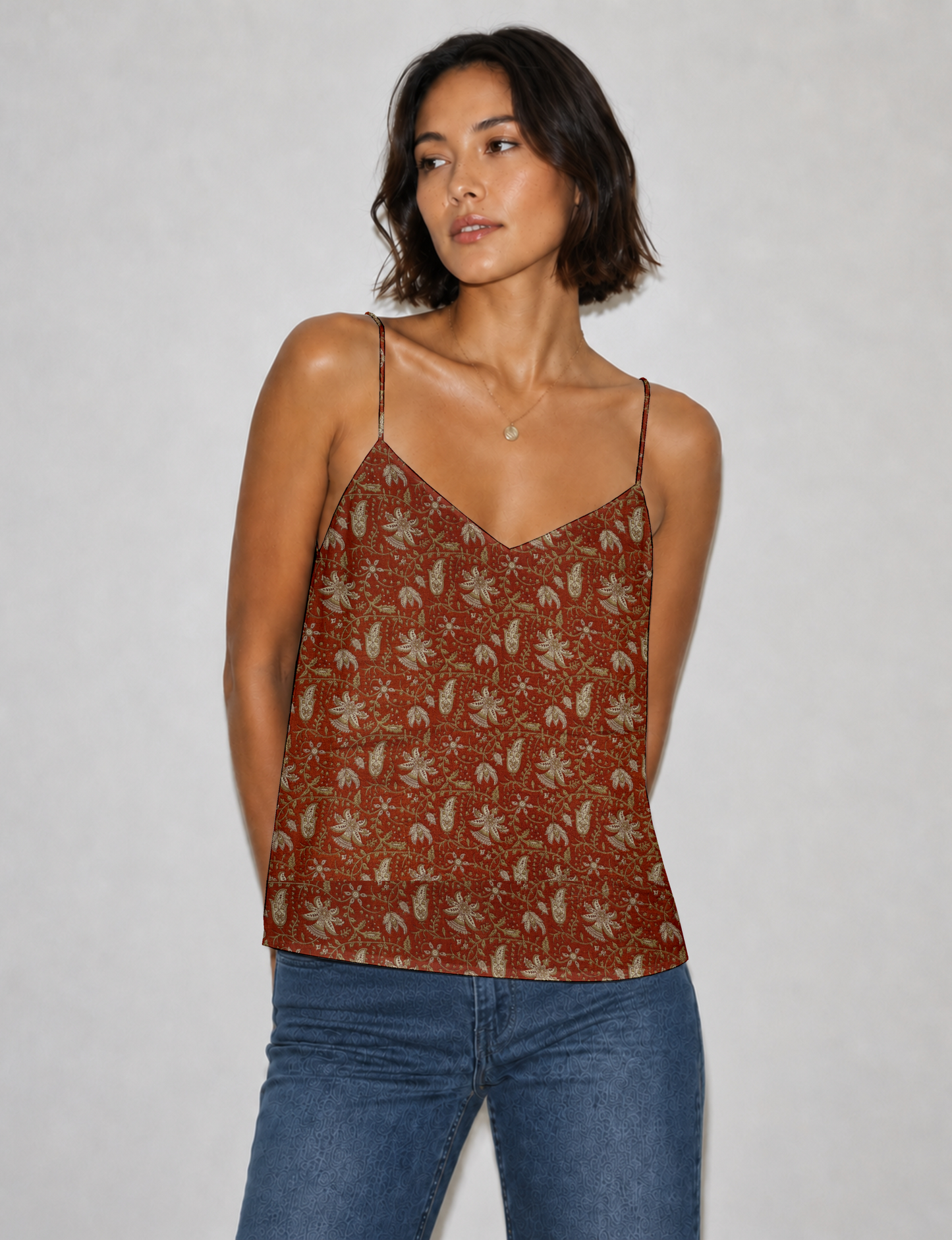 Women's sleeveless slip top with a relaxed straight fit, soft V-neckline, deep V-back, and delicate spaghetti straps.
