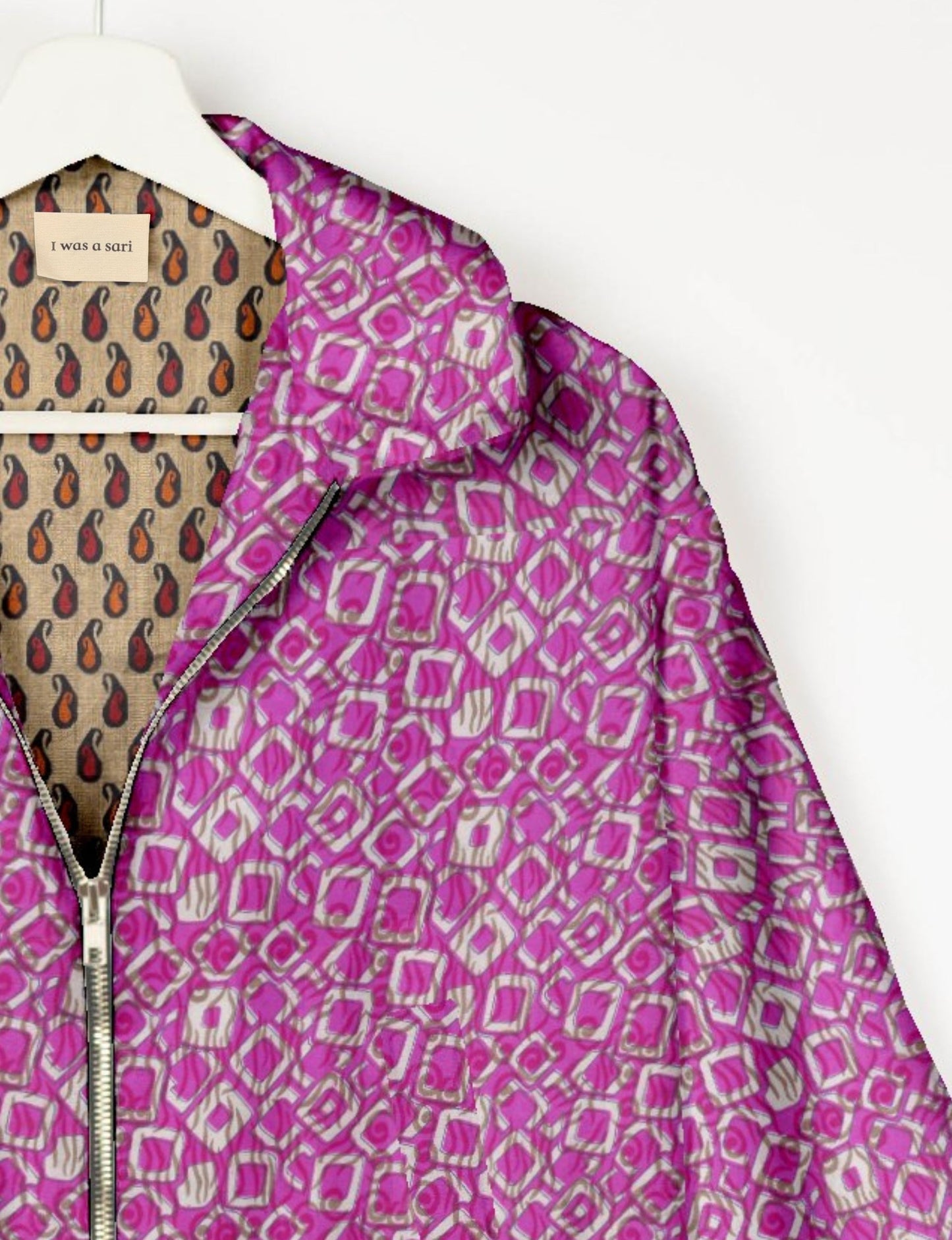 Upcycled Bomber Jacket made from recycled sari materials, featuring a cute cropped shape, elasticated hem and cuffs, and contrast sari print lining. Sustainable apparel promoting eco-friendly fashion and ethical clothing.