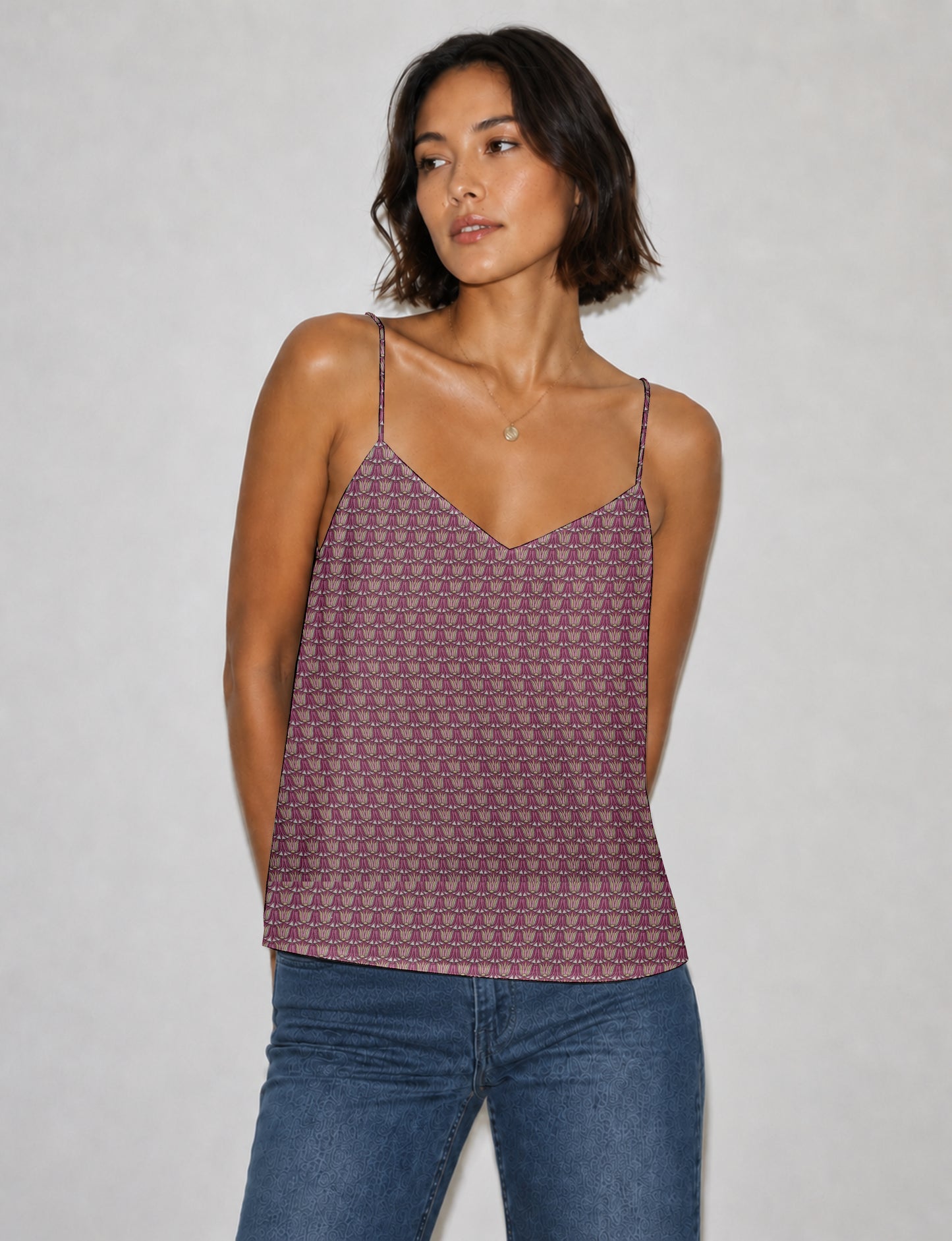 Women's sleeveless slip top with a relaxed straight fit, soft V-neckline, deep V-back, and delicate spaghetti straps.