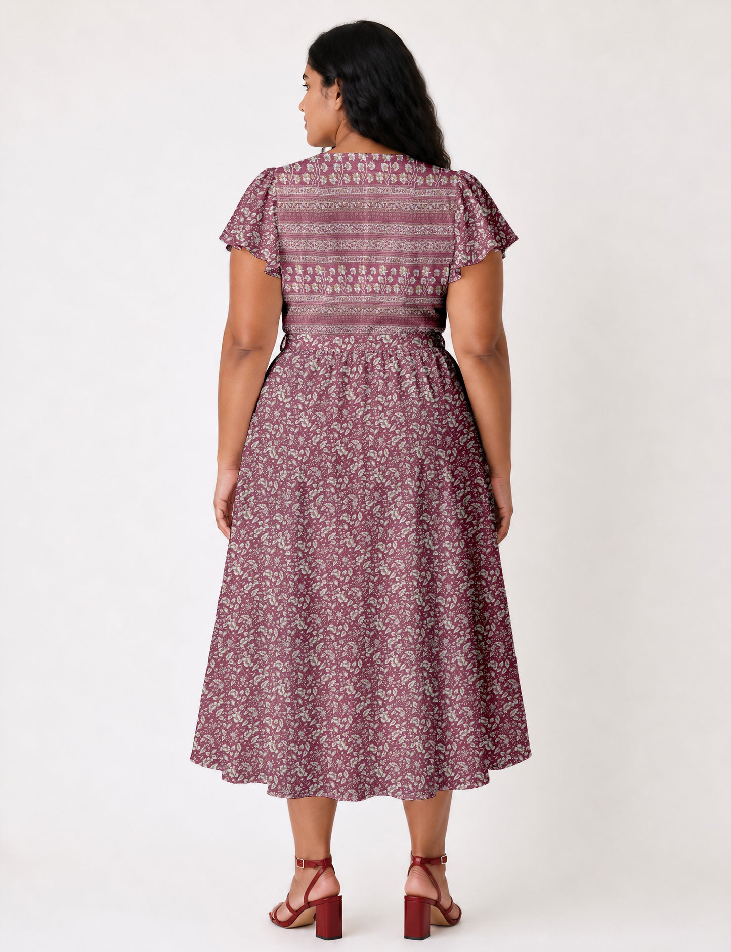 Elegant midi wrap dress with a V-neckline, adjustable waist tie, fitted bodice, and flared skirt for a timeless, flattering silhouette.