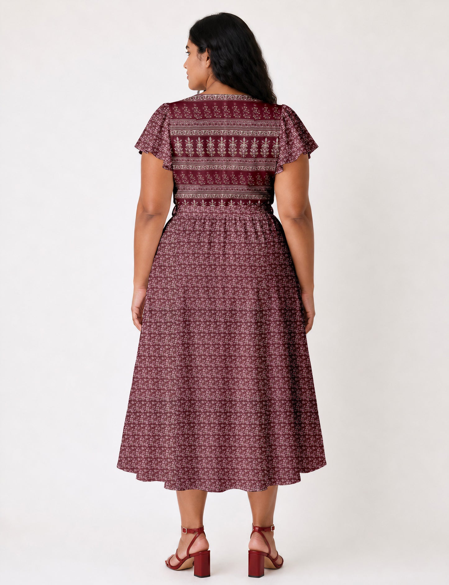 Elegant midi wrap dress with a V-neckline, adjustable waist tie, fitted bodice, and flared skirt for a timeless, flattering silhouette.