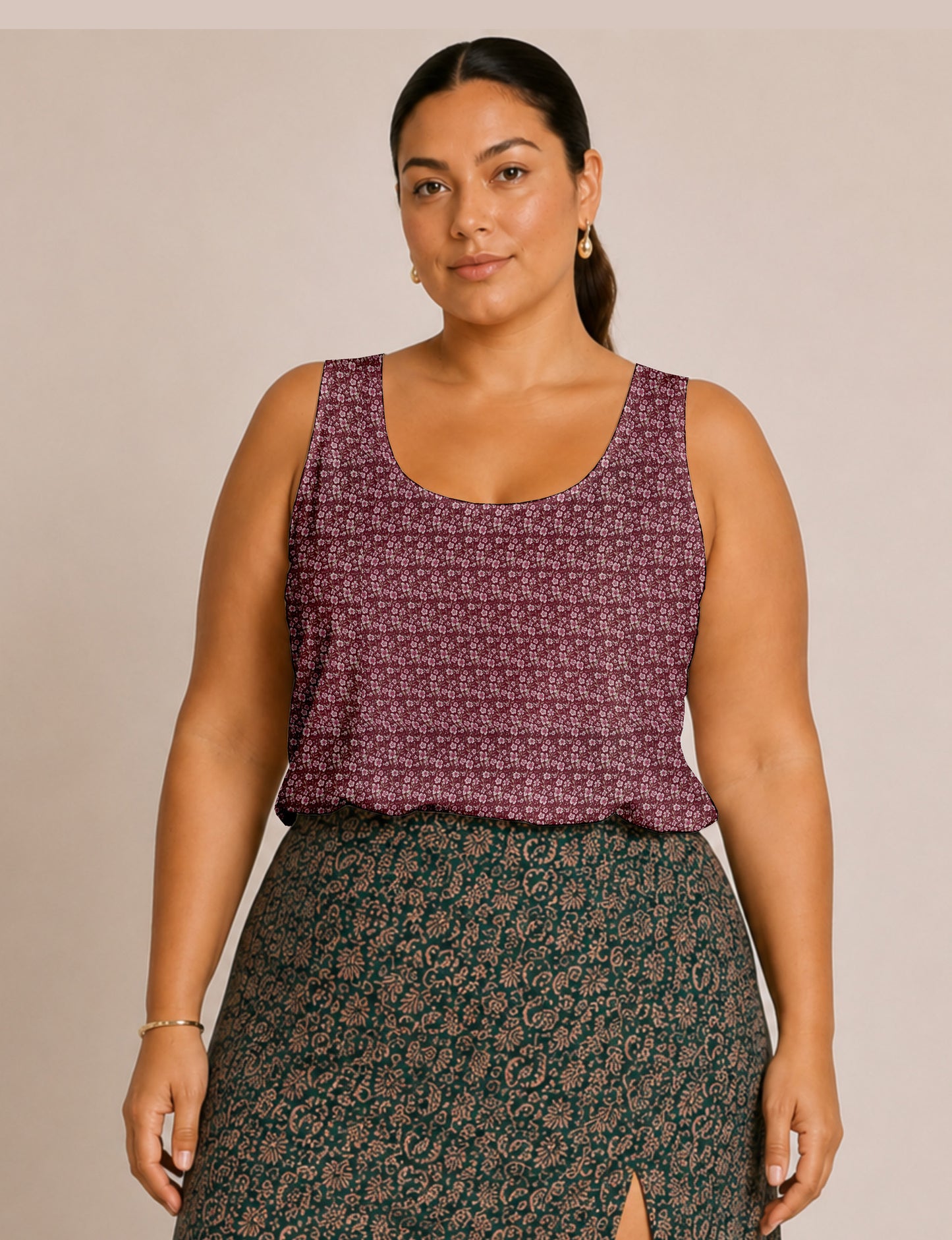 Women's sleeveless blouse with a relaxed straight fit, wide scoop neckline, deep scoop back, and hip-length silhouette.