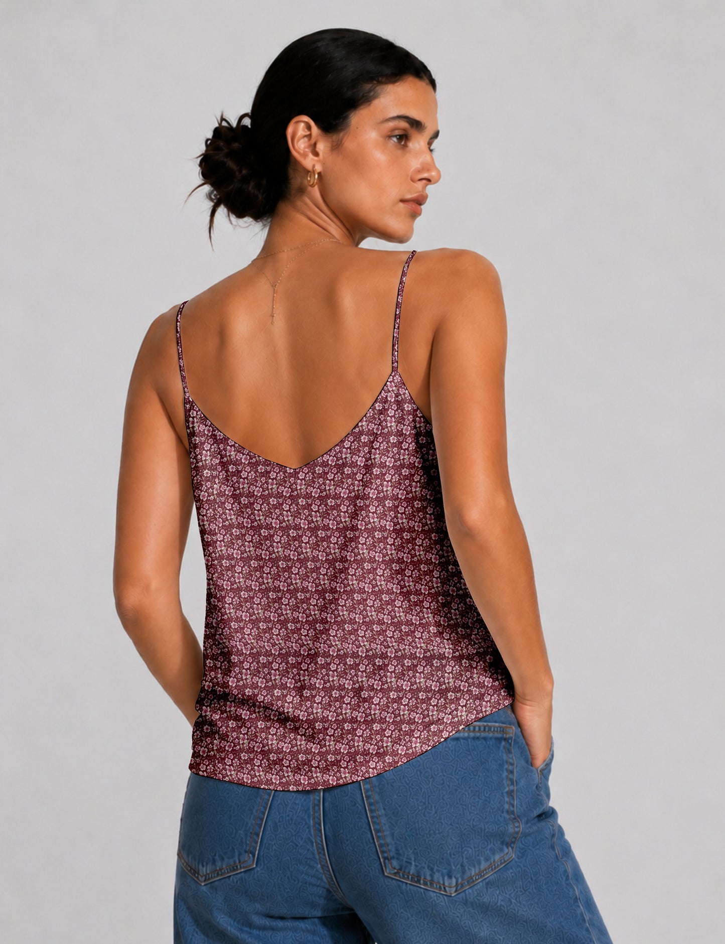 Women's sleeveless slip top with a relaxed straight fit, soft V-neckline, deep V-back, and delicate spaghetti straps.
