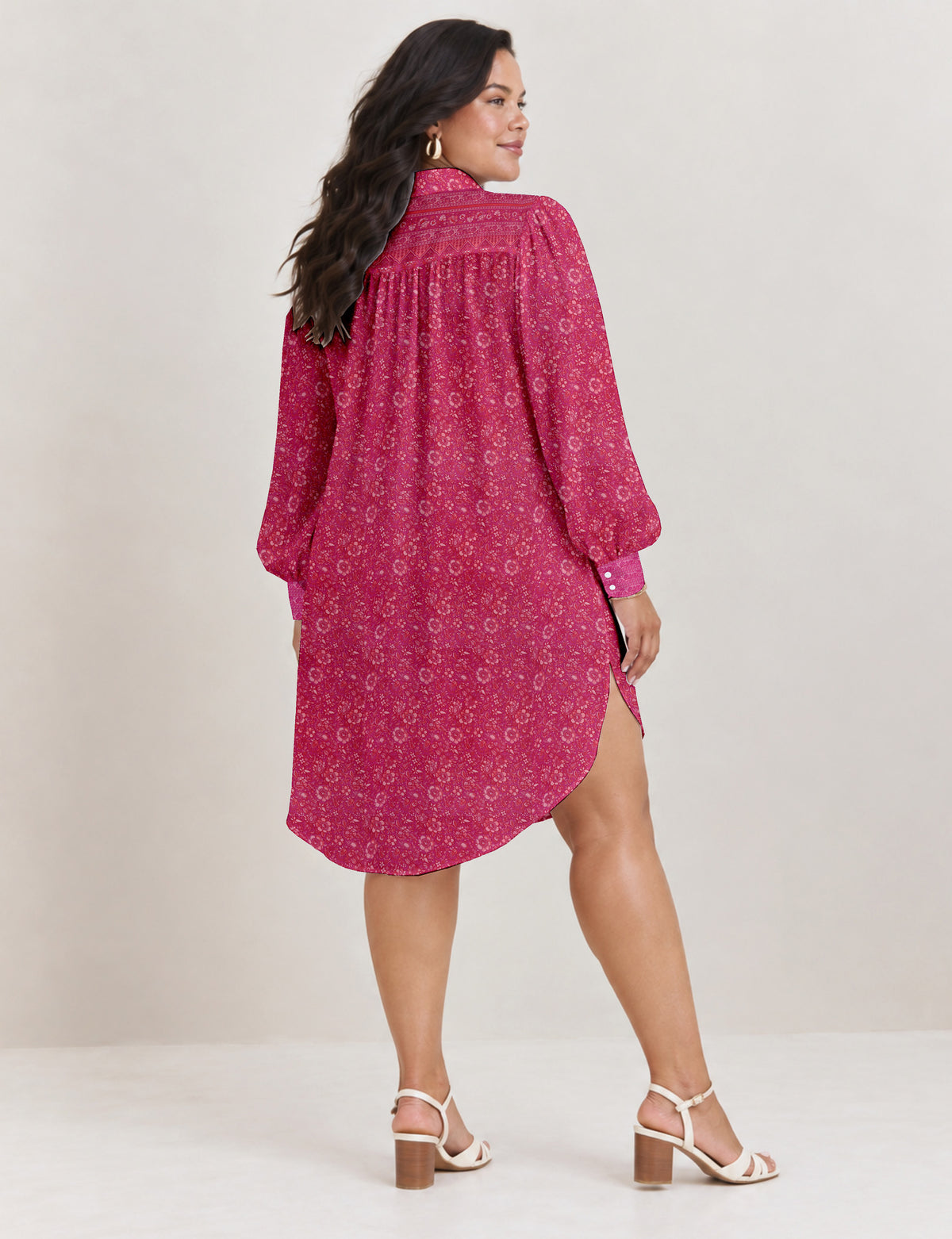 High low shirt with a relaxed fit, button-down front, classic collar, gathered shoulders and full-length blouson sleeves.