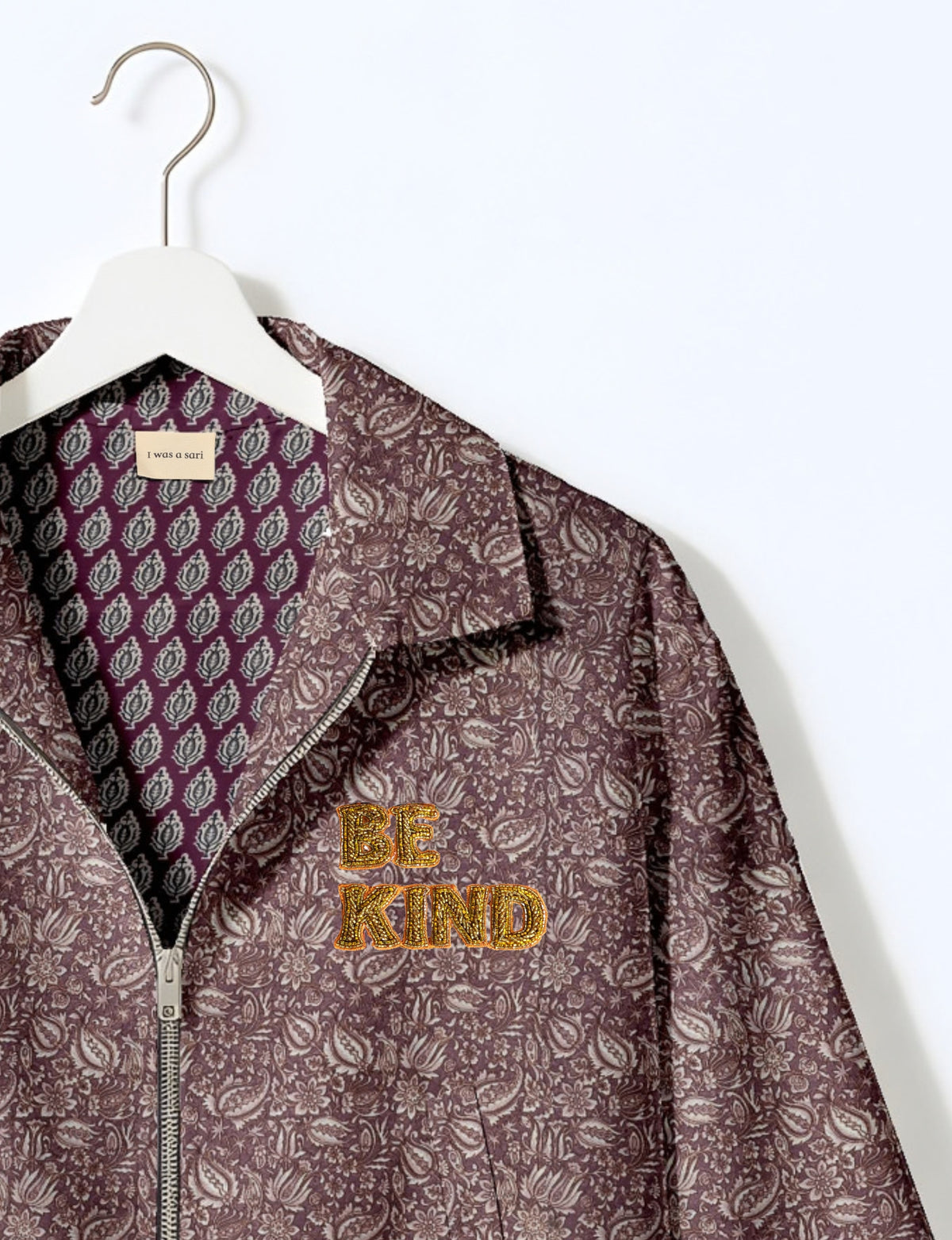 BE KIND Bomber jacket made from upcycled sari fabric with handcrafted Aari embroidery by female artisans.