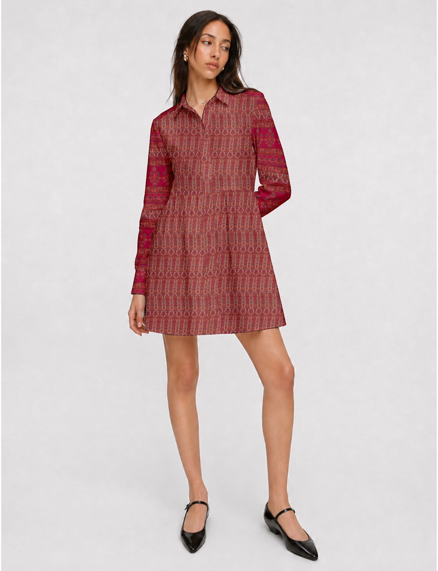 Short shirt dress with a relaxed A-line silhouette, point collar, partial button placket, gathered waist, side pockets, and full-length cuffed sleeves.
