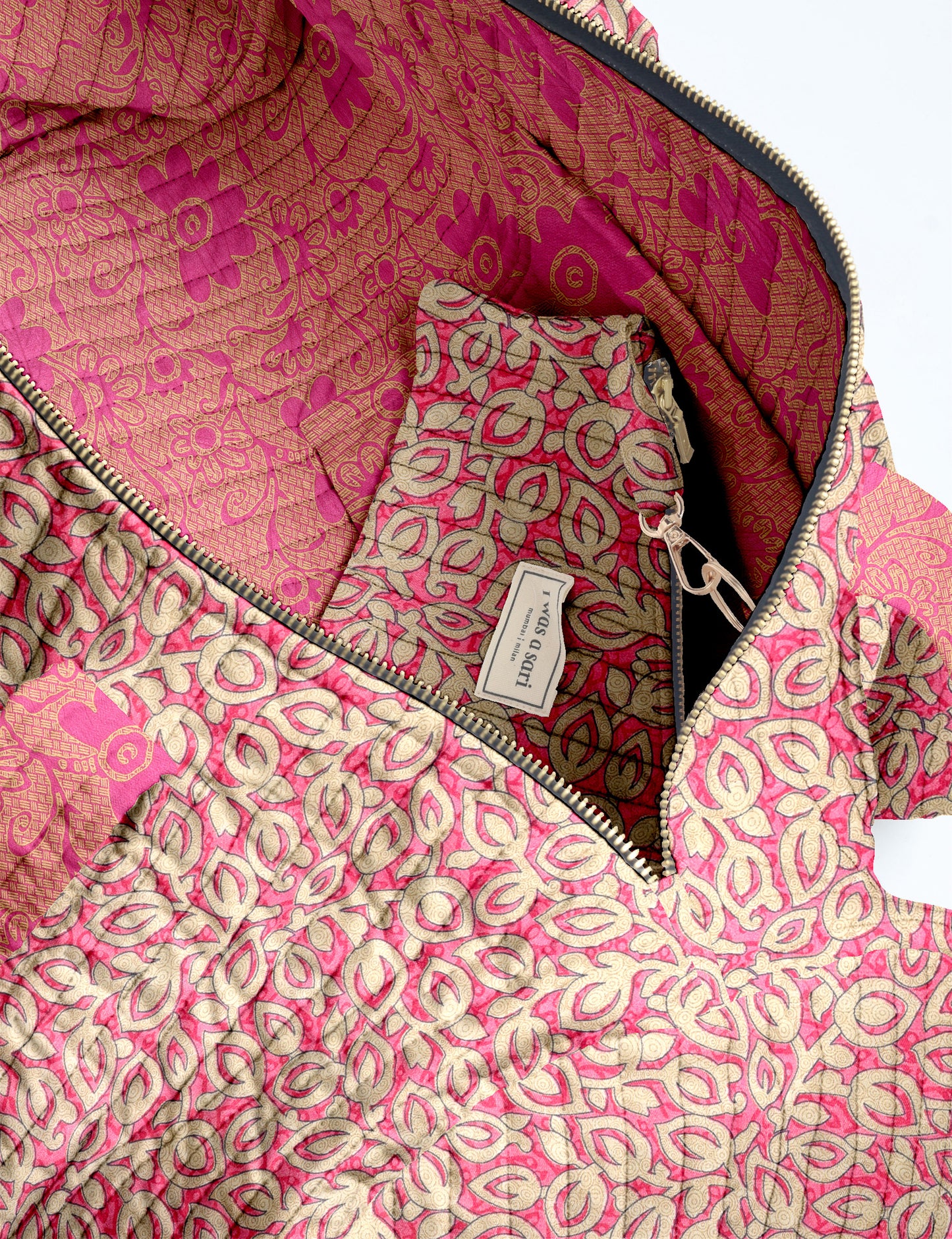 Quilted brown paisley bowling bag with gold zipper, floral interior lining, and interior key clip with label inside pocket
