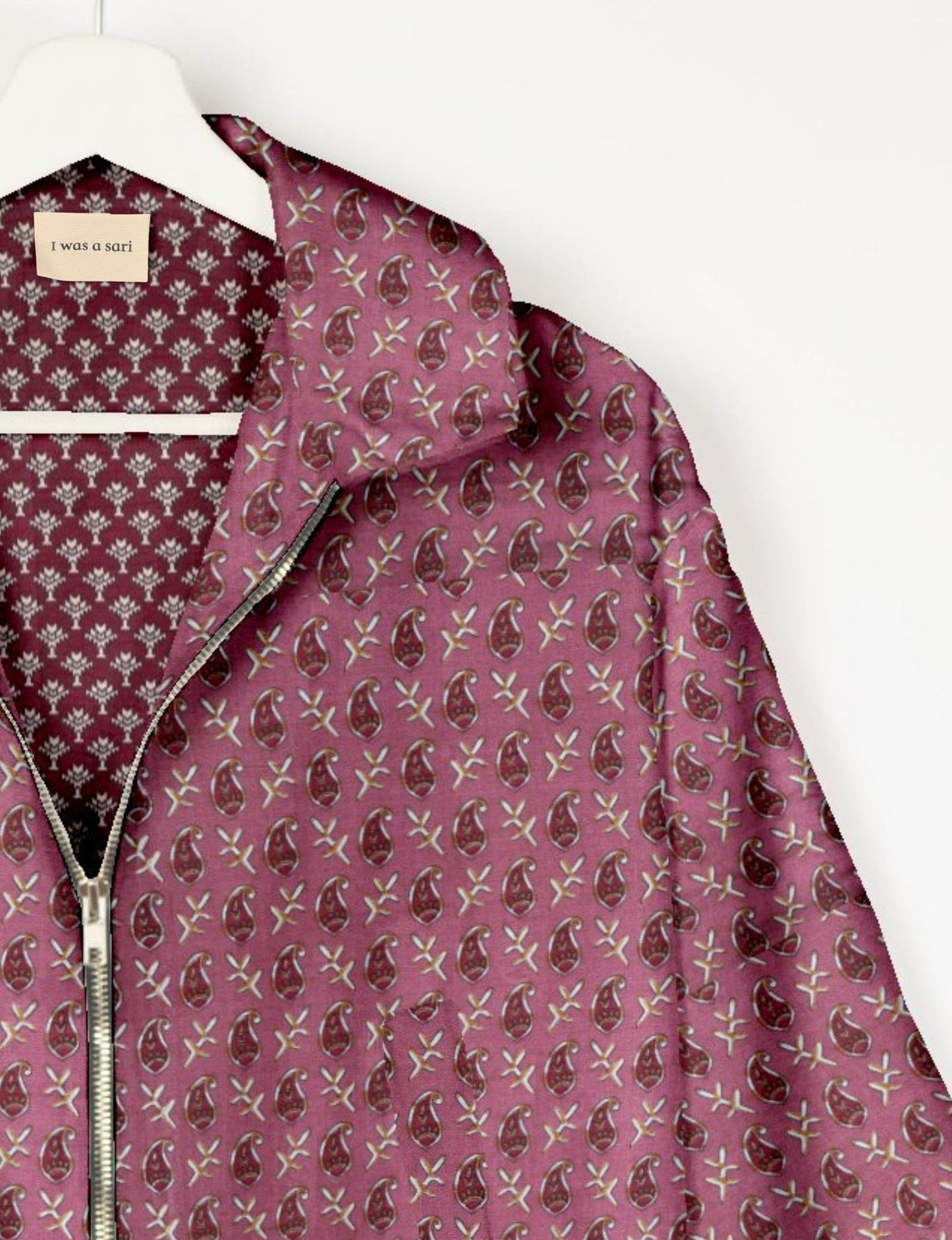 Upcycled Bomber Jacket made from recycled sari materials, featuring a cute cropped shape, elasticated hem and cuffs, and contrast sari print lining. Sustainable apparel promoting eco-friendly fashion and ethical clothing.