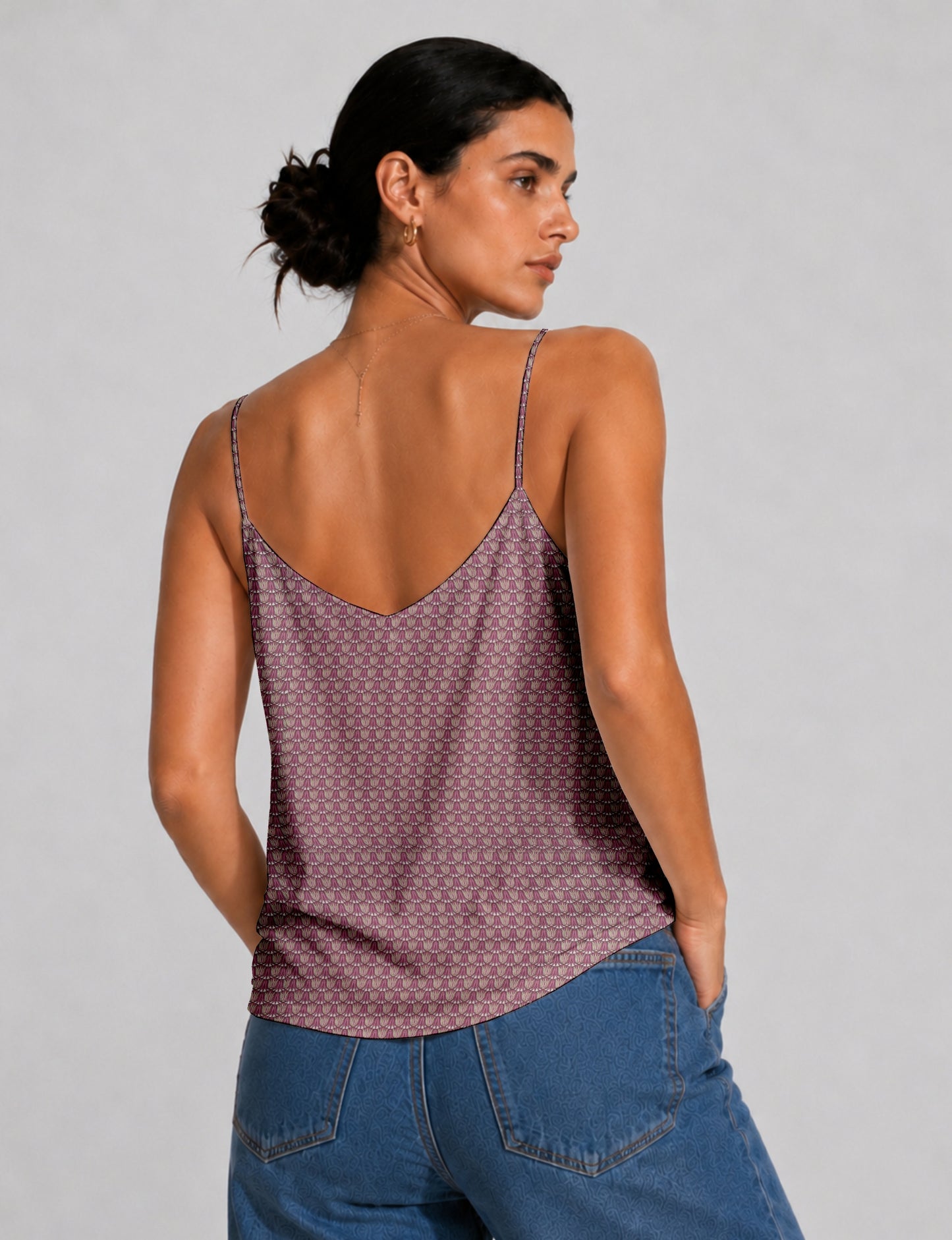 Women's sleeveless slip top with a relaxed straight fit, soft V-neckline, deep V-back, and delicate spaghetti straps.