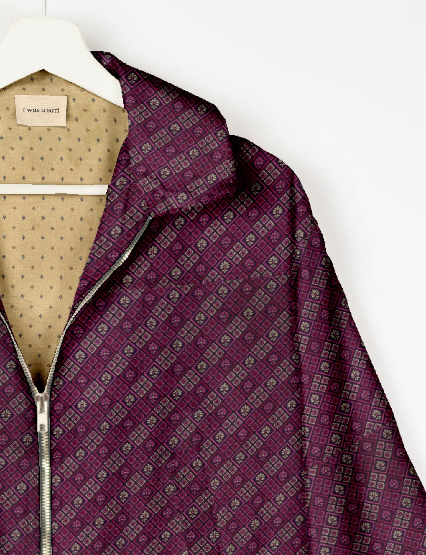 Upcycled Bomber Jacket made from recycled sari materials, featuring a cute cropped shape, elasticated hem and cuffs, and contrast sari print lining. Sustainable apparel promoting eco-friendly fashion and ethical clothing.