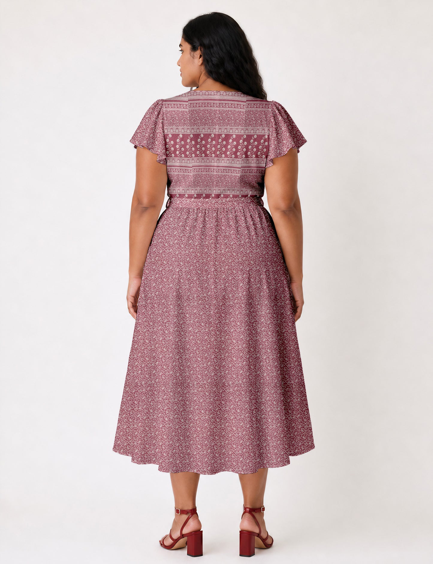 Elegant midi wrap dress with a V-neckline, adjustable waist tie, fitted bodice, and flared skirt for a timeless, flattering silhouette.