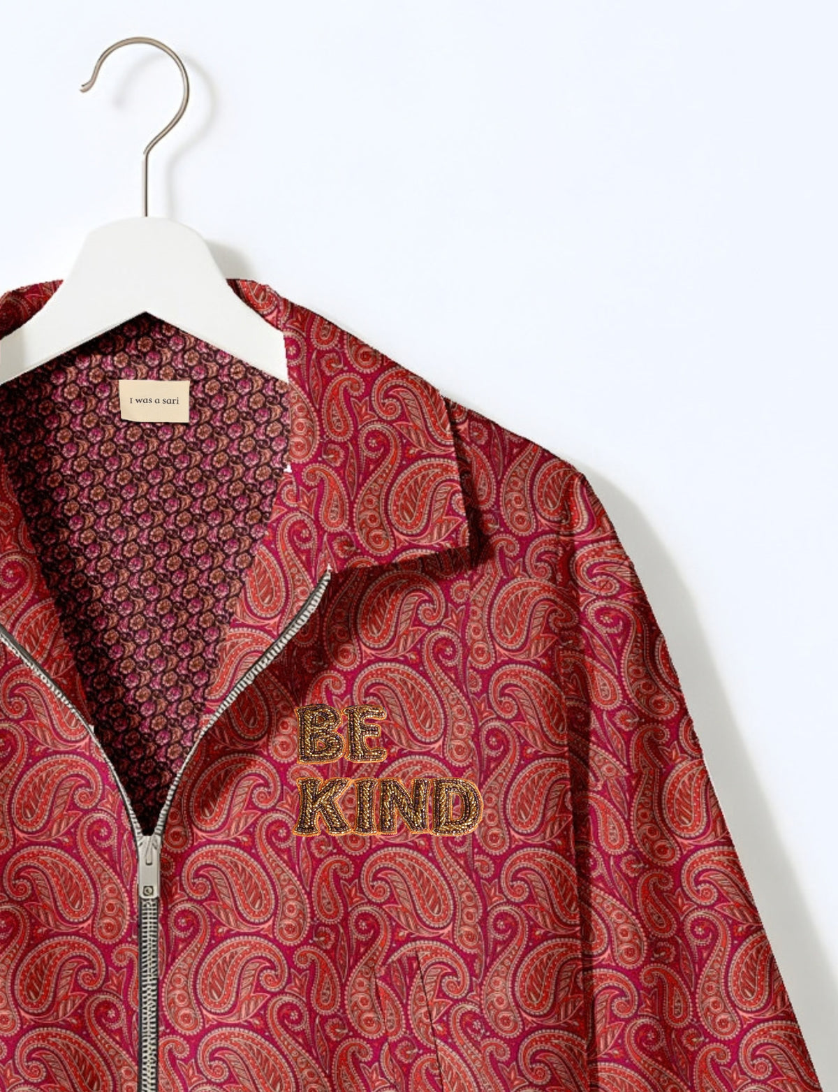 BE KIND Bomber jacket made from upcycled sari fabric with handcrafted Aari embroidery by female artisans.