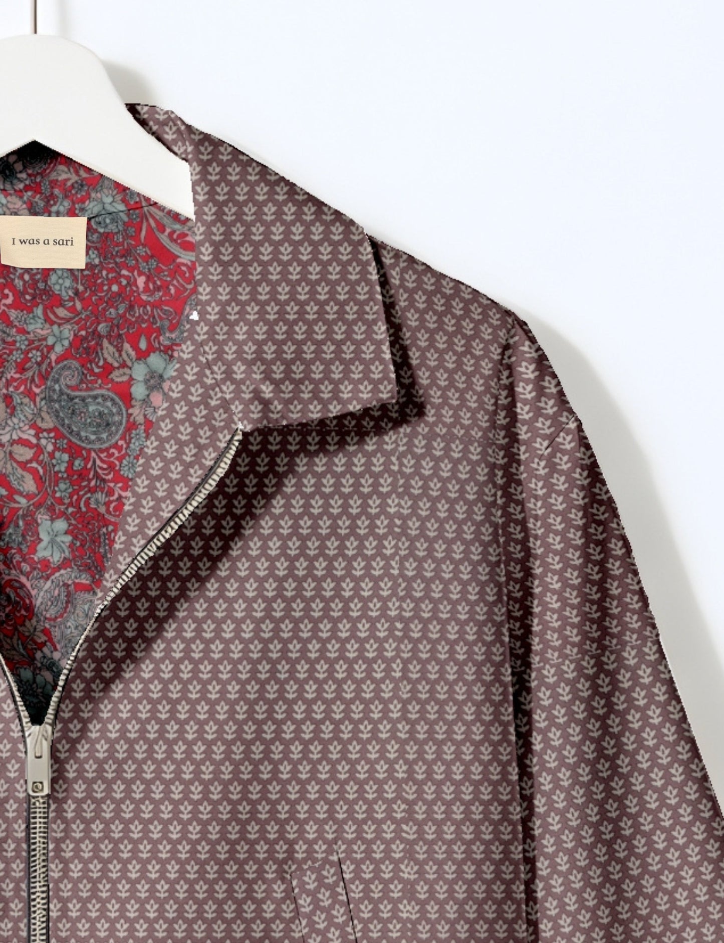 Upcycled Bomber Jacket made from recycled sari materials, featuring a cute cropped shape, elasticated hem and cuffs, and contrast sari print lining. Sustainable apparel promoting eco-friendly fashion and ethical clothing.