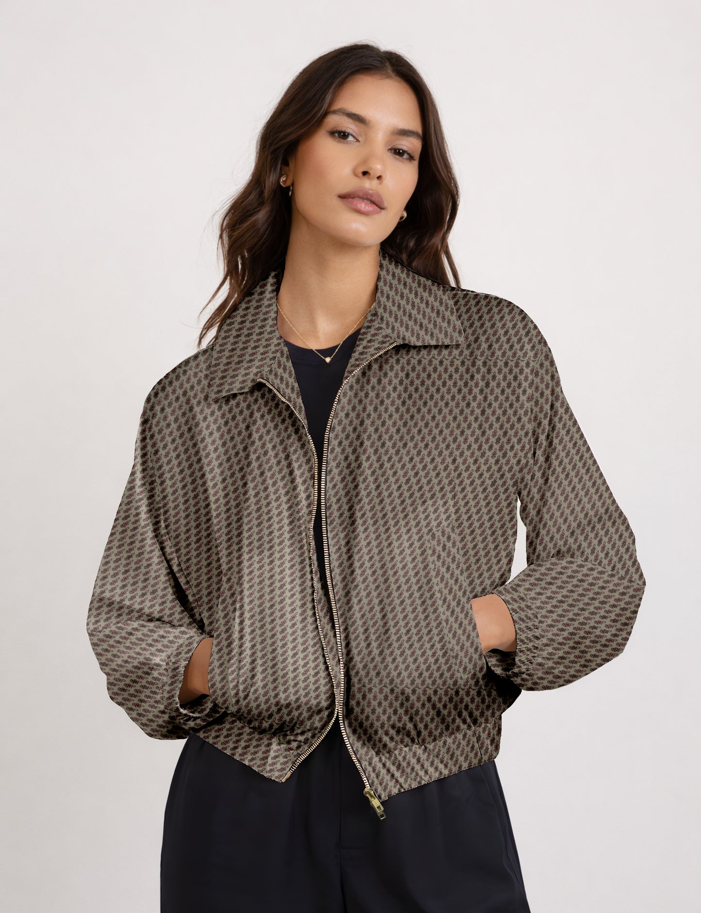 Women's cropped bomber jacket with twin metallic front zippers, welt pockets, elasticated hem and cuffs, and contrast sari print lining.