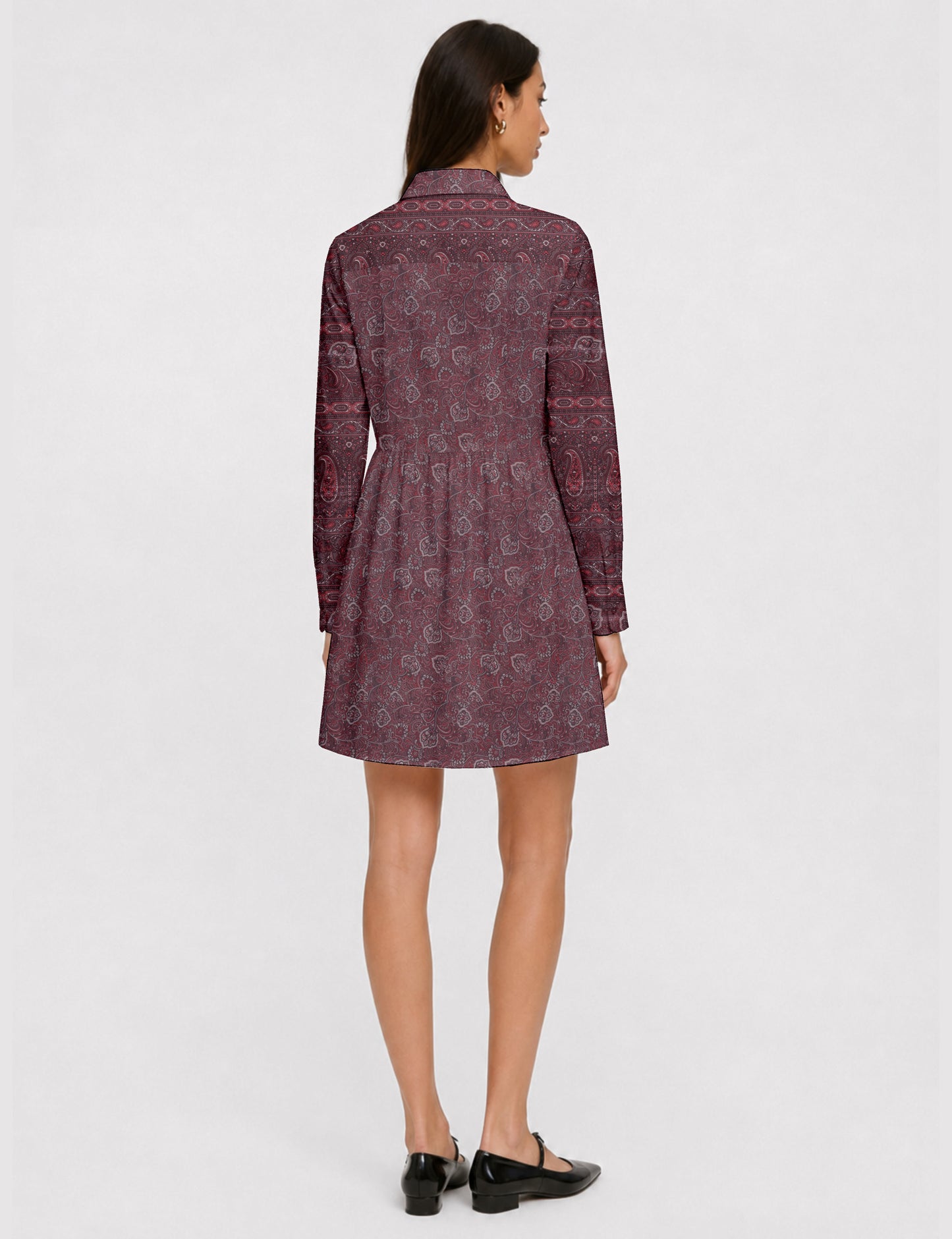 Short shirt dress with a relaxed A-line silhouette, point collar, partial button placket, gathered waist, side pockets, and full-length cuffed sleeves.