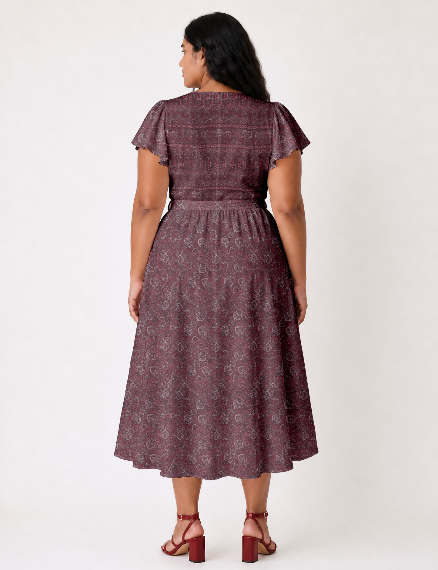 Elegant midi wrap dress with a V-neckline, adjustable waist tie, fitted bodice, and flared skirt for a timeless, flattering silhouette.