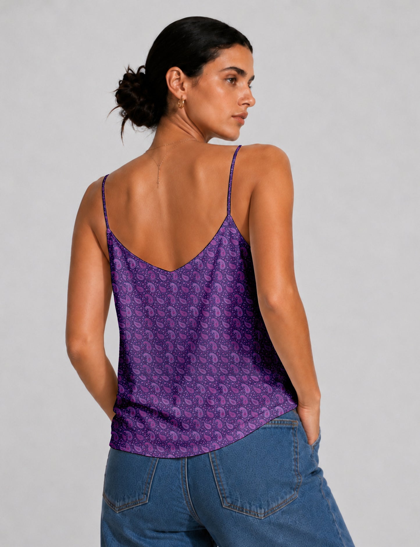 Women's sleeveless slip top with a relaxed straight fit, soft V-neckline, deep V-back, and delicate spaghetti straps.