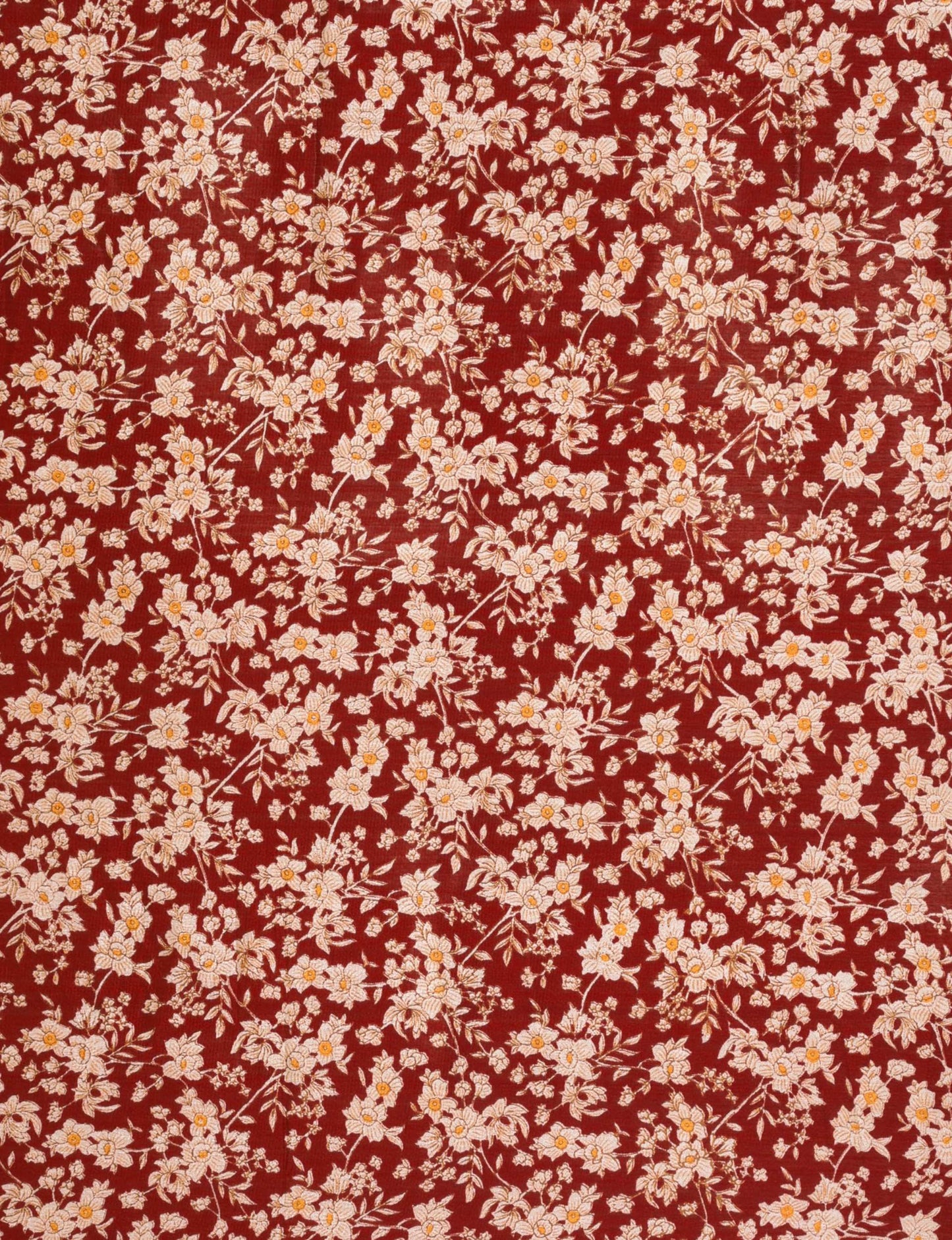 Red fabric with dense white and light pink floral print featuring small yellow centers and green leaves