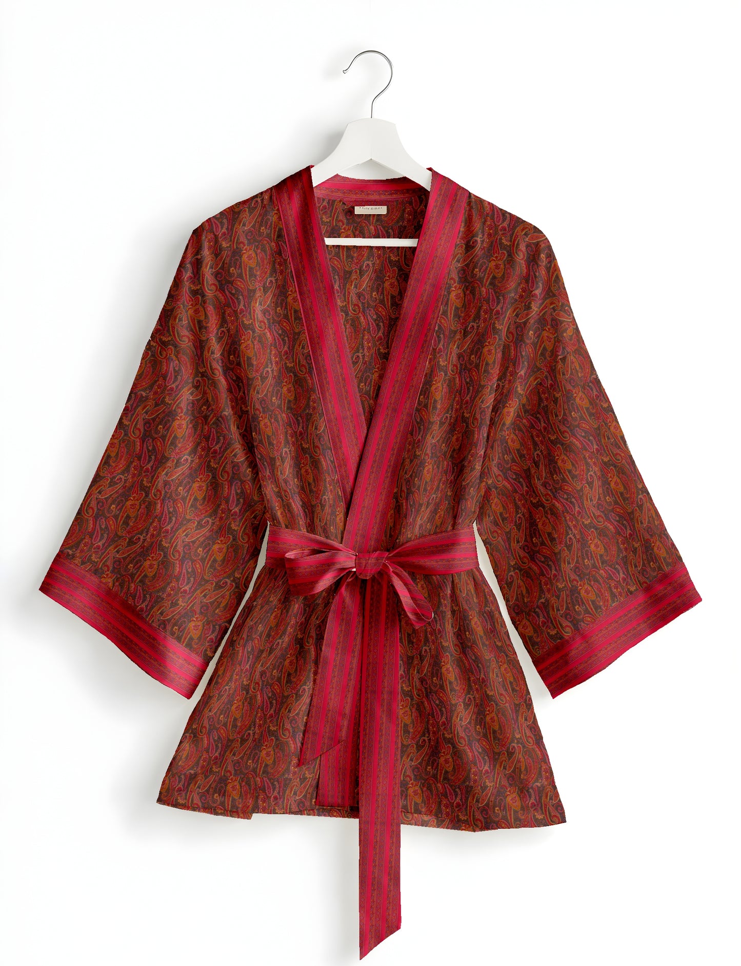Short kimono robe with wrap front, V-neckline, wide sleeves, waist tie, and concealed skort detail.