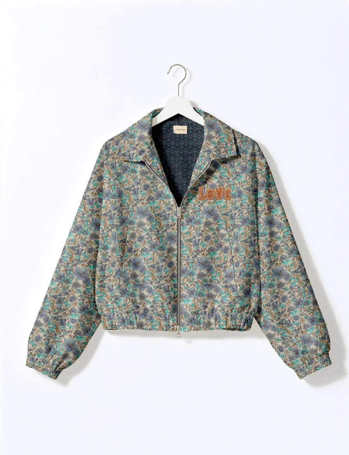 Love Bomber Jacket made from recycled fabric, featuring hand-stitched Aari embroidery. A unique piece of zero-waste clothing, part of the circular fashion movement. Designed with upcycled materials for a stylish yet environmentally friendly clothing choice.