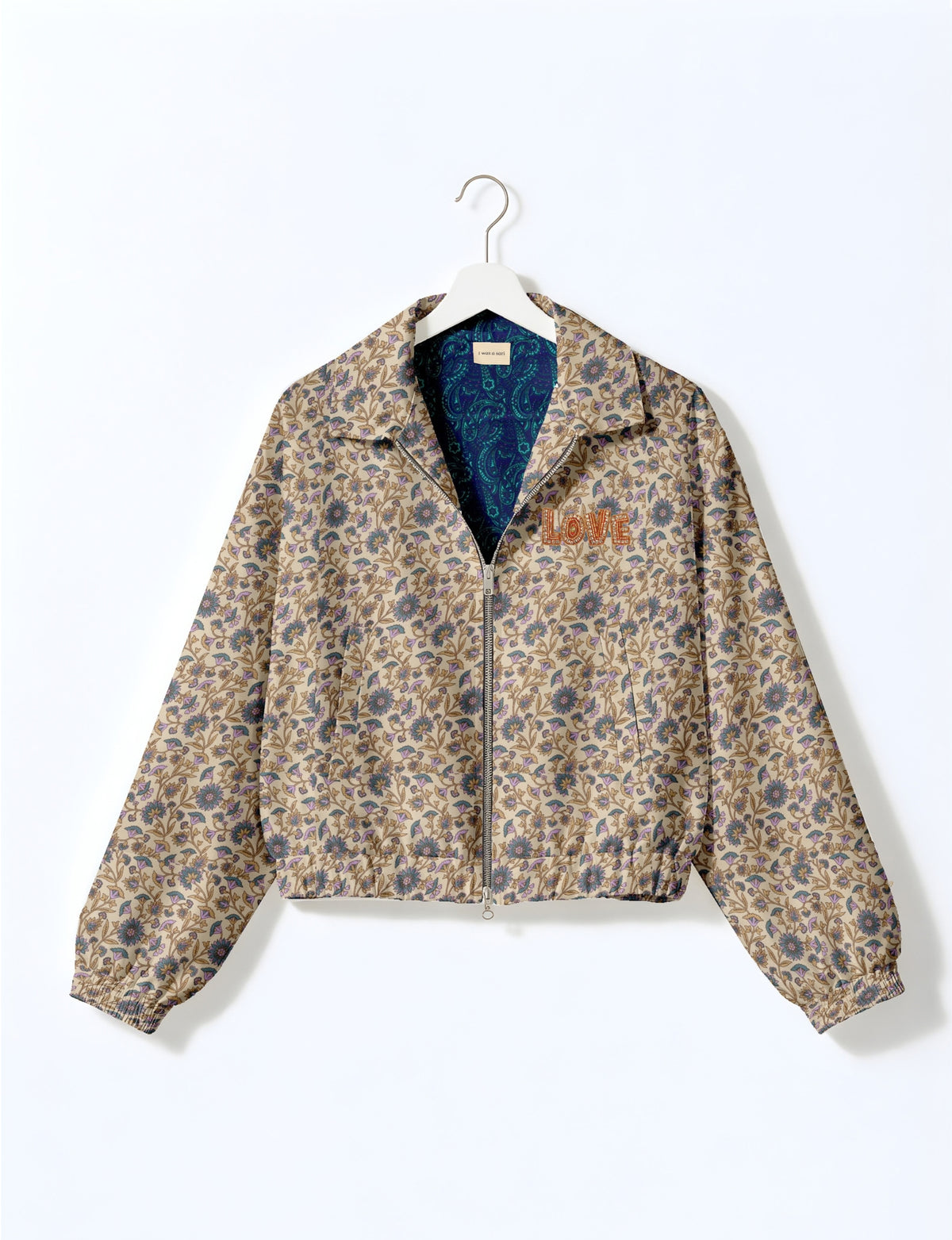 Love Bomber Jacket made from recycled fabric, featuring hand-stitched Aari embroidery. A unique piece of zero-waste clothing, part of the circular fashion movement. Designed with upcycled materials for a stylish yet environmentally friendly clothing choice.