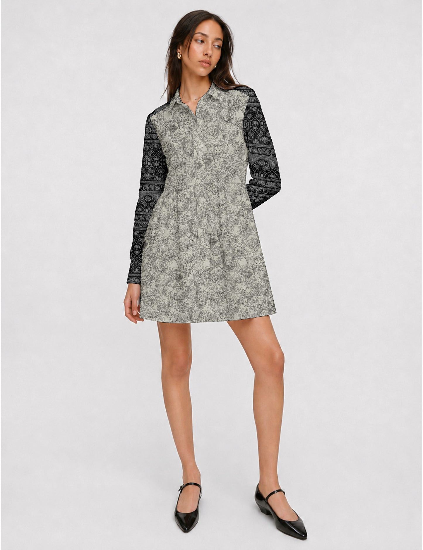 Short shirt dress with a relaxed A-line silhouette, point collar, partial button placket, gathered waist, side pockets, and full-length cuffed sleeves.