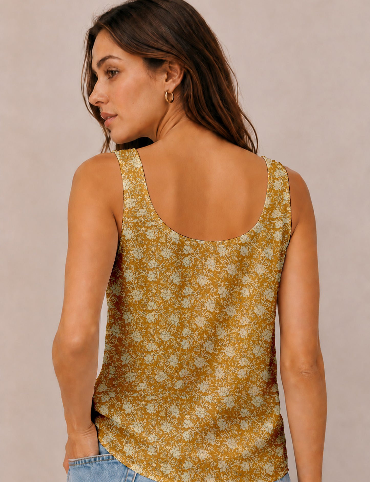 Women's sleeveless blouse with a relaxed straight fit, wide scoop neckline, deep scoop back, and hip-length silhouette.