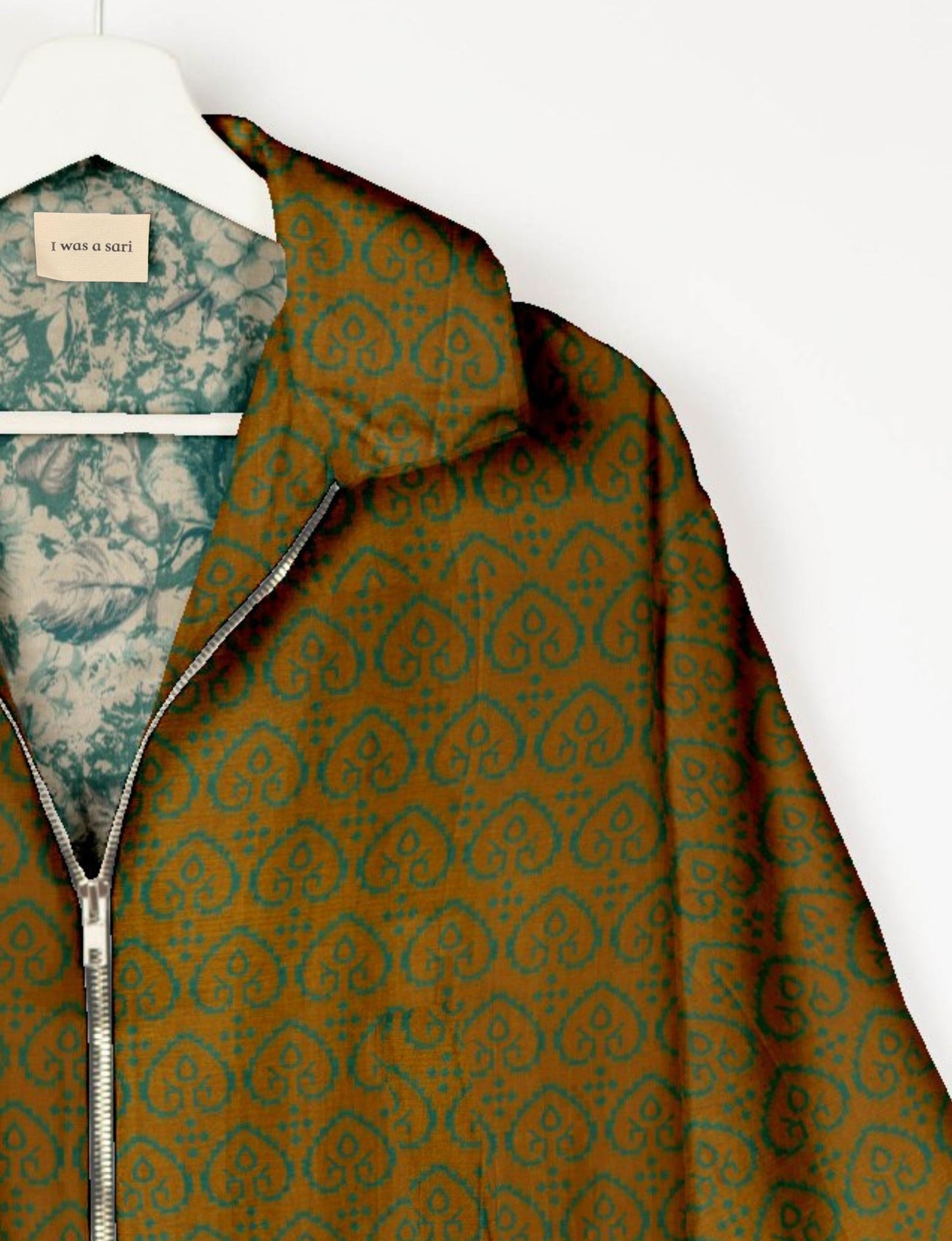 Upcycled Bomber Jacket made from recycled sari materials, featuring a cute cropped shape, elasticated hem and cuffs, and contrast sari print lining. Sustainable apparel promoting eco-friendly fashion and ethical clothing.