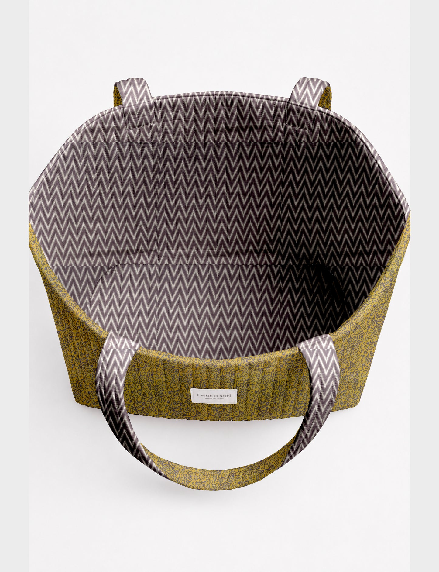 Large quilted beach bag with spacious rectangular design, reinforced shoulder straps, and open-top construction for everyday use and travel.