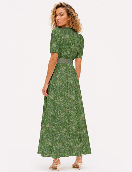 Maxi romantic dress with a fitted bodice, V-neckline, functional button placket, structured waist panel, short sleeves, and a softly flared ankle-length A-line skirt.