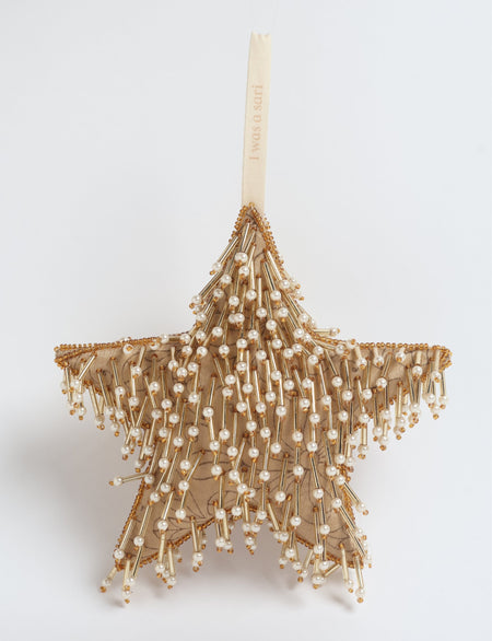 Gold colored star ornament