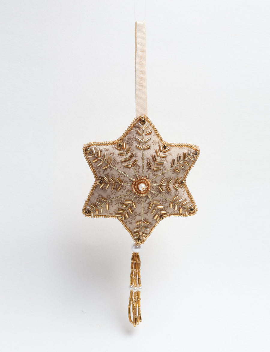 Gold colored snowflake ornament