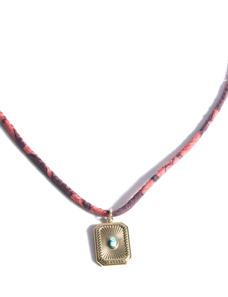 Cord necklace with charm