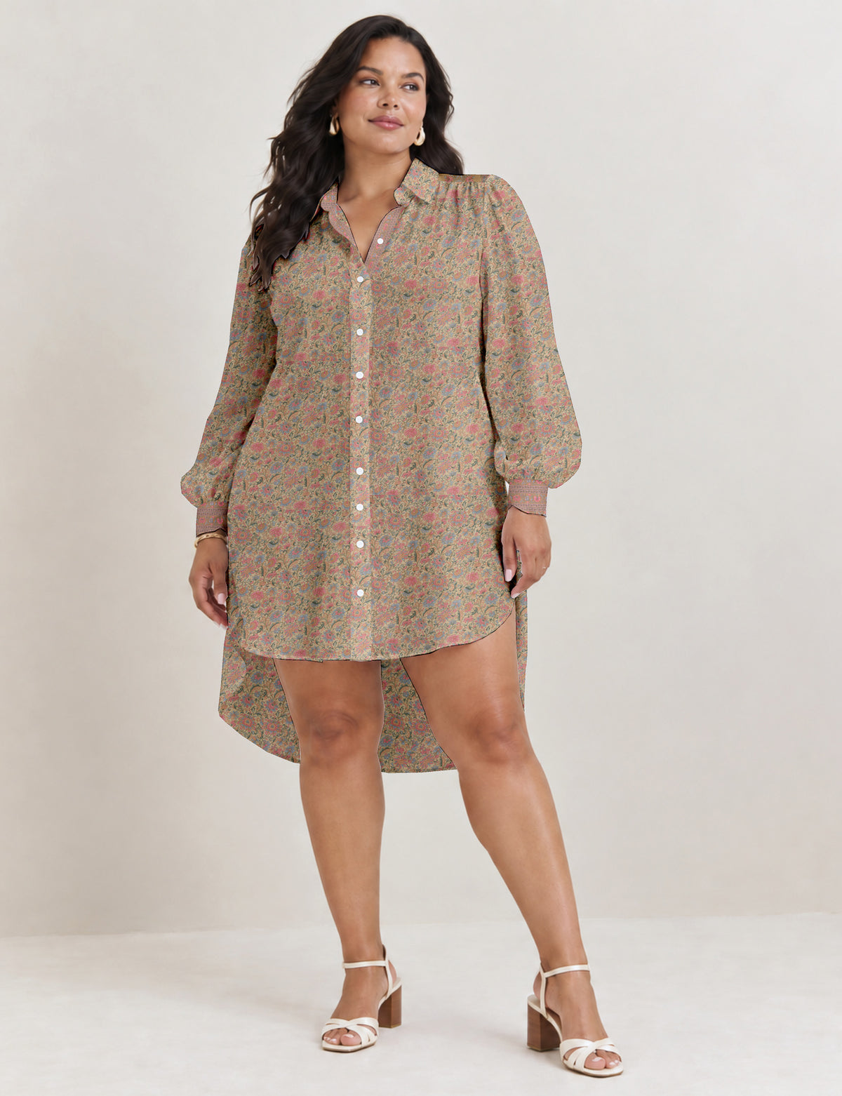 High low shirt with a relaxed fit, button-down front, classic collar, gathered shoulders and full-length blouson sleeves.
