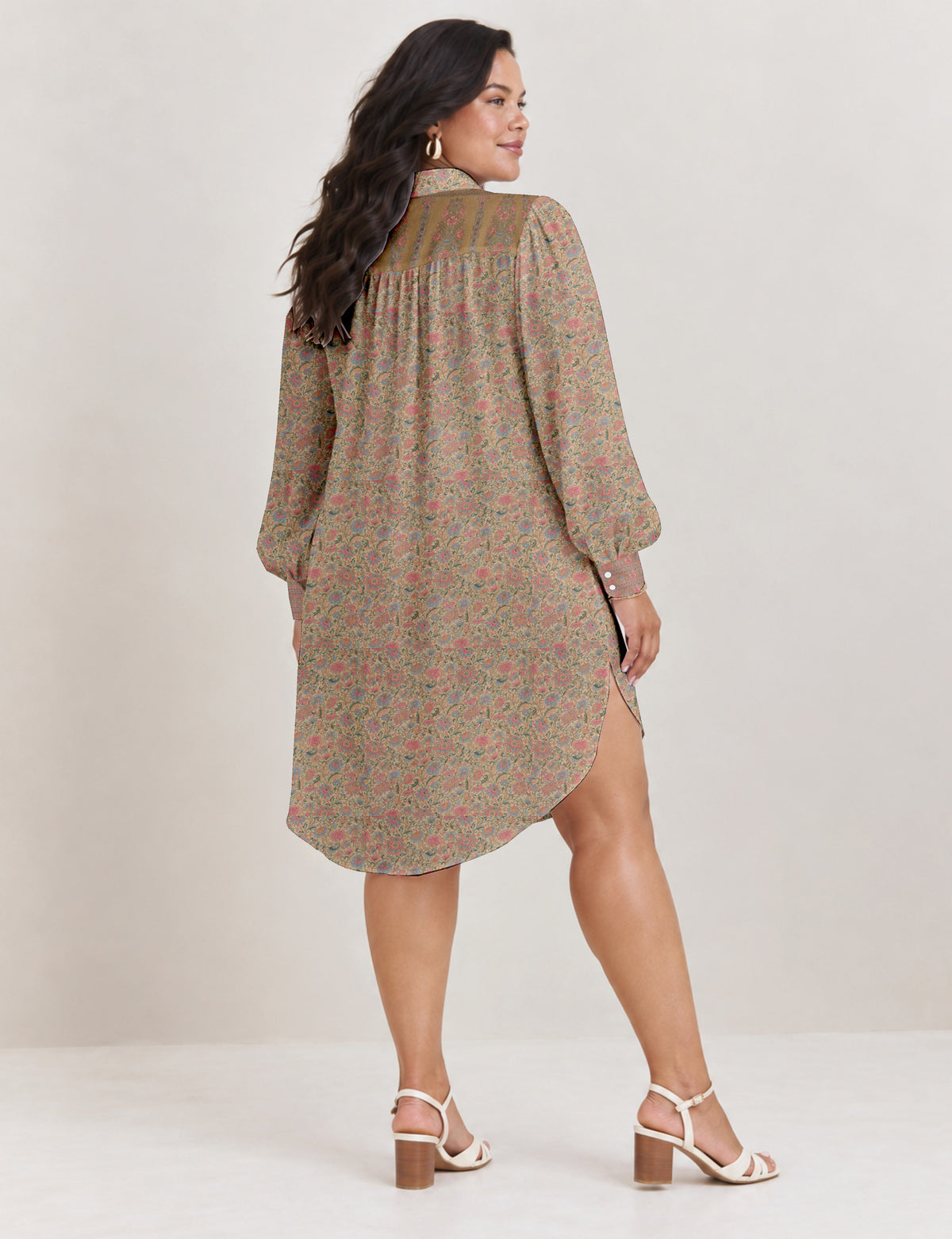 High low shirt with a relaxed fit, button-down front, classic collar, gathered shoulders and full-length blouson sleeves.