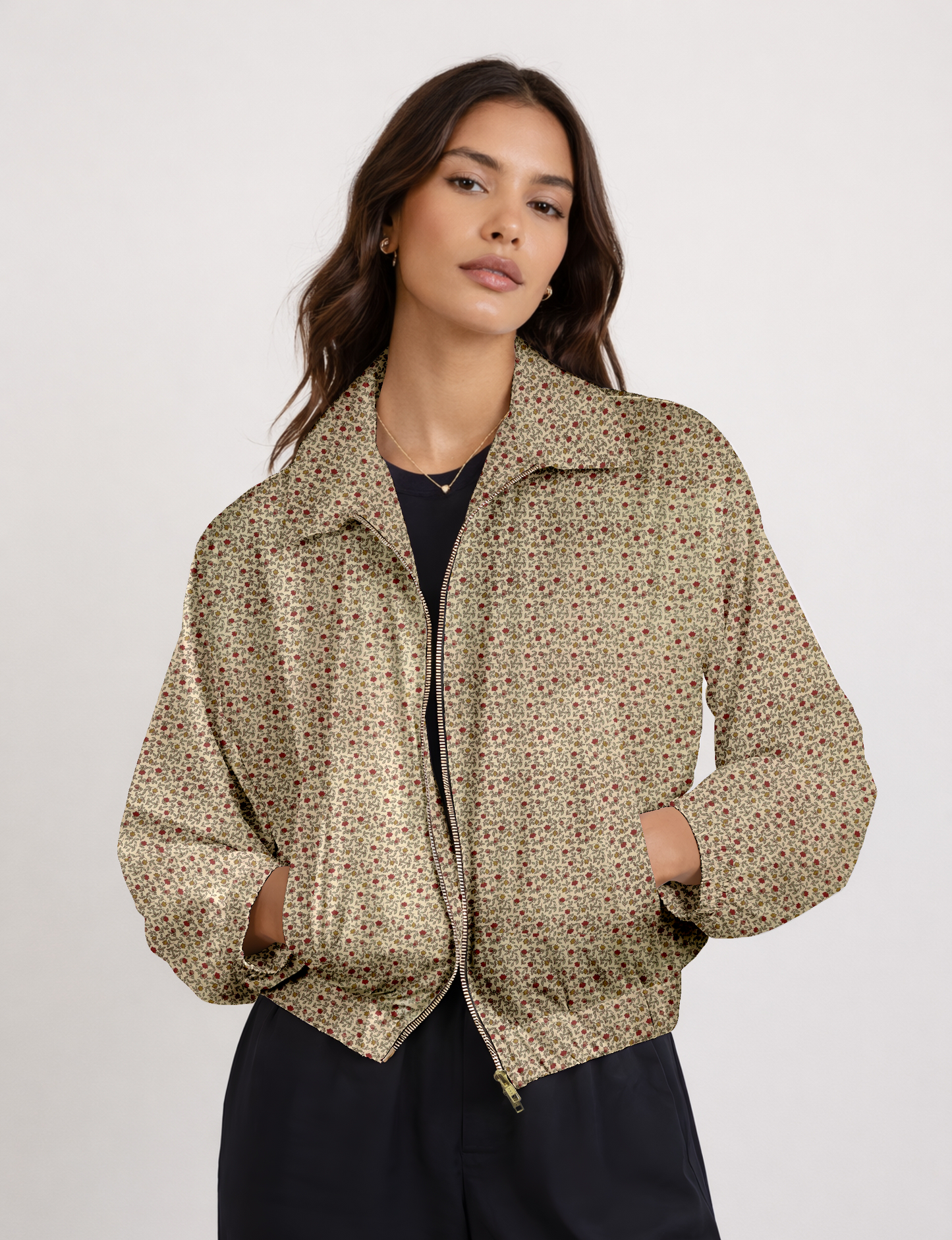 Women's cropped bomber jacket with twin metallic front zippers, welt pockets, elasticated hem and cuffs, and contrast sari print lining.