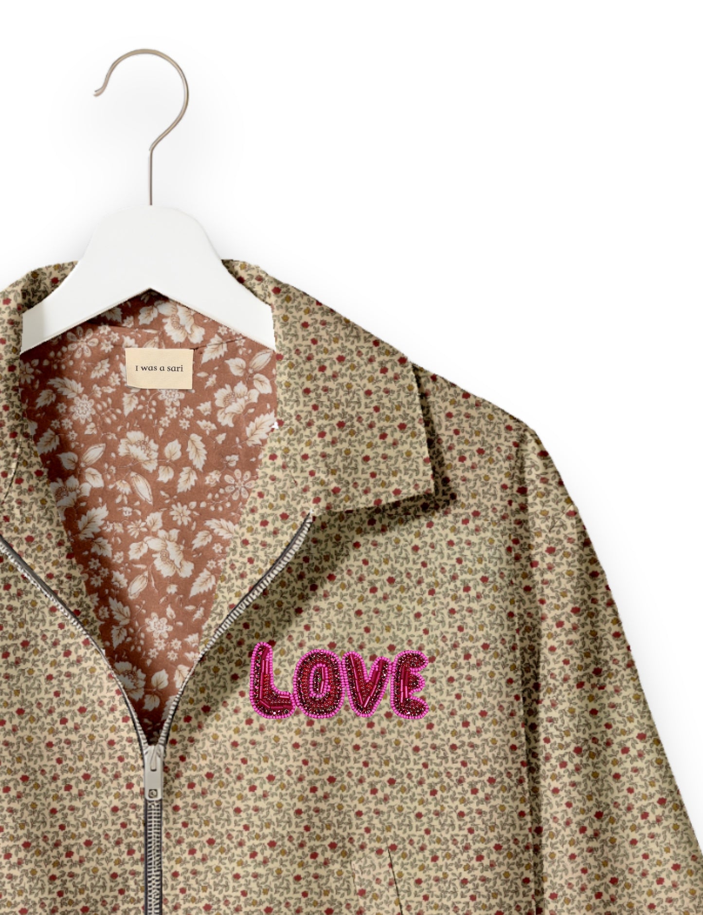 Love Bomber Jacket made from recycled fabric, featuring hand-stitched Aari embroidery. A unique piece of zero-waste clothing, part of the circular fashion movement. Designed with upcycled materials for a stylish yet environmentally friendly clothing choice.