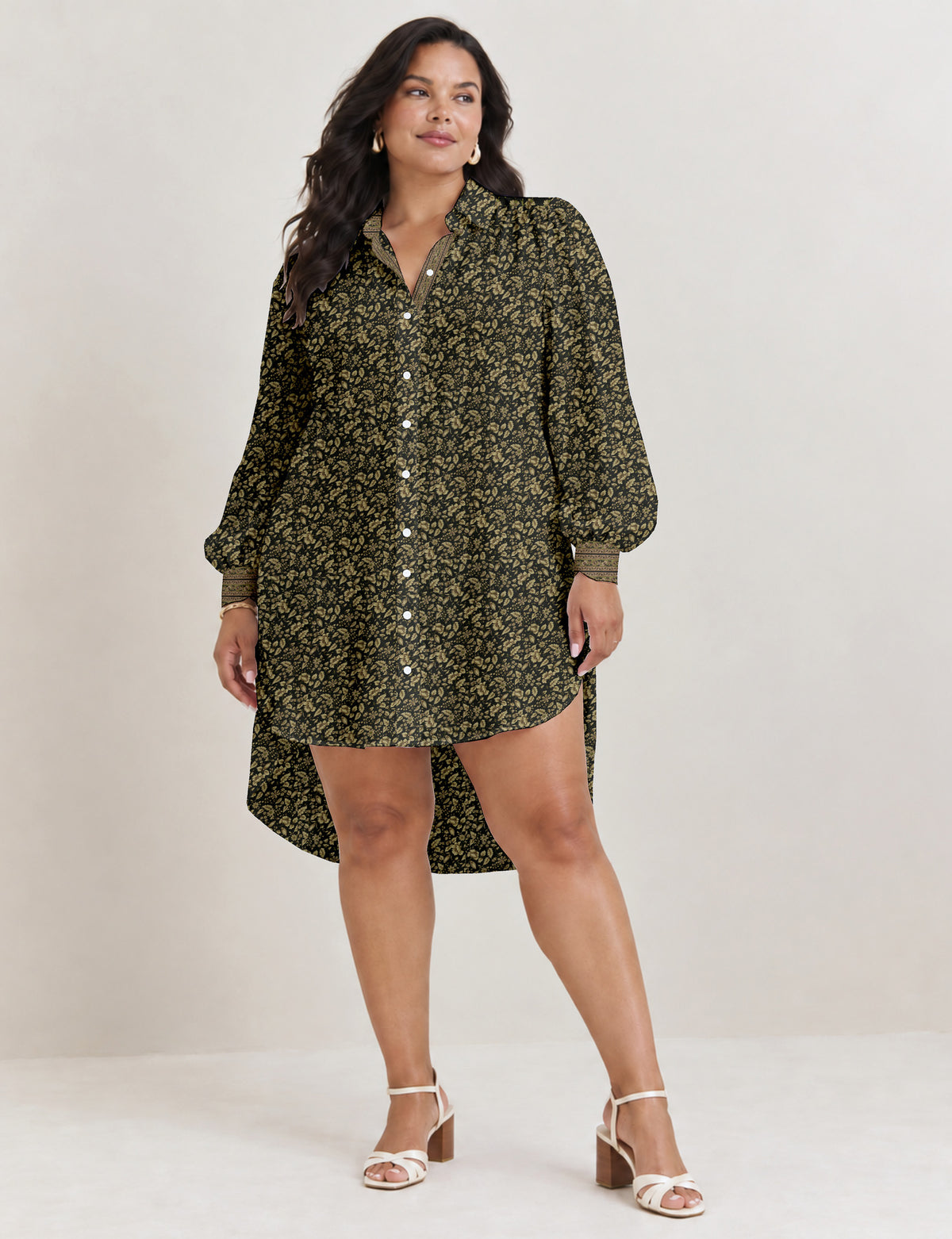 High low shirt with a relaxed fit, button-down front, classic collar, gathered shoulders and full-length blouson sleeves.