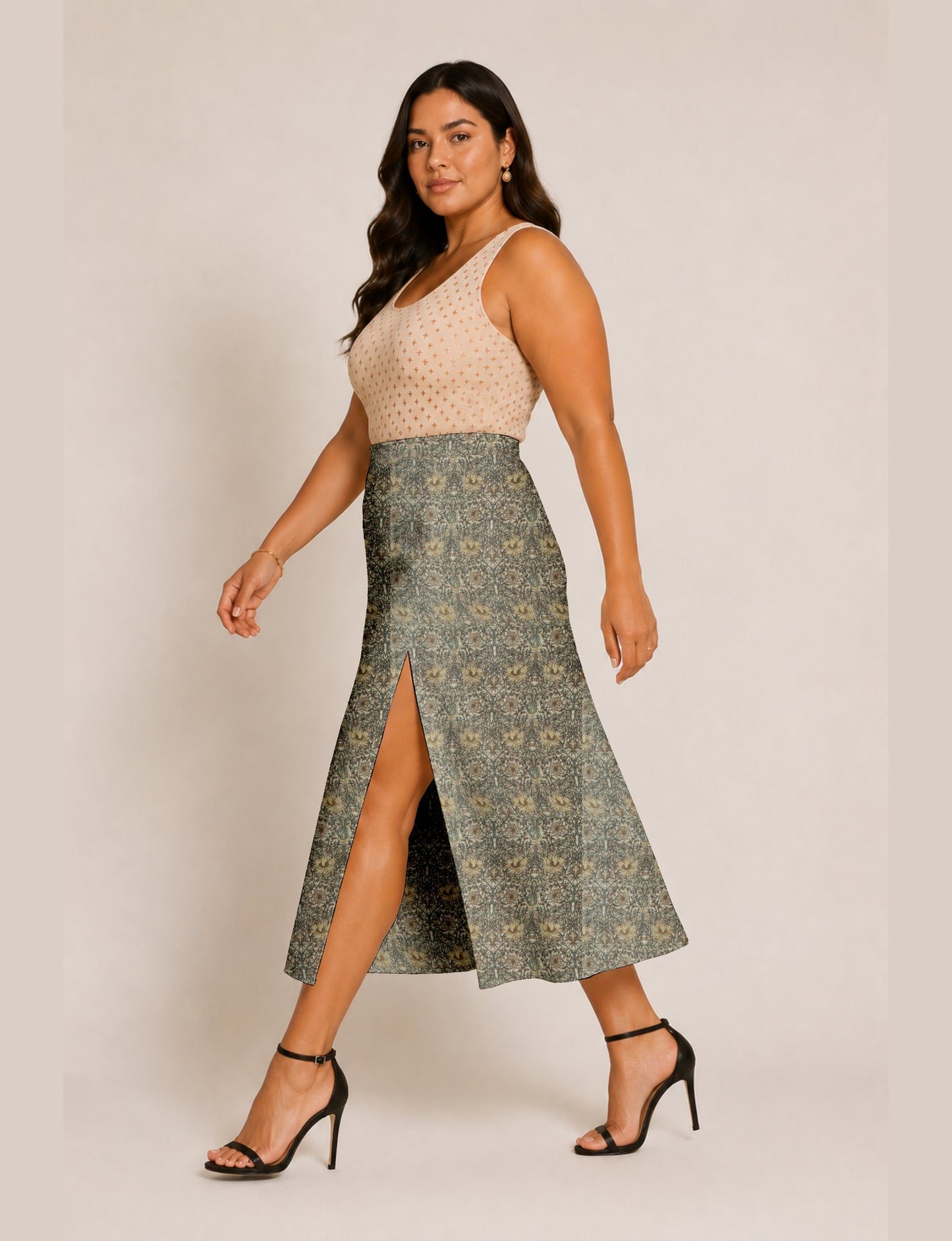 Woman wearing a yellow and navy blue A-line skirt with a slit and a sleeveless beige top with brown micro print