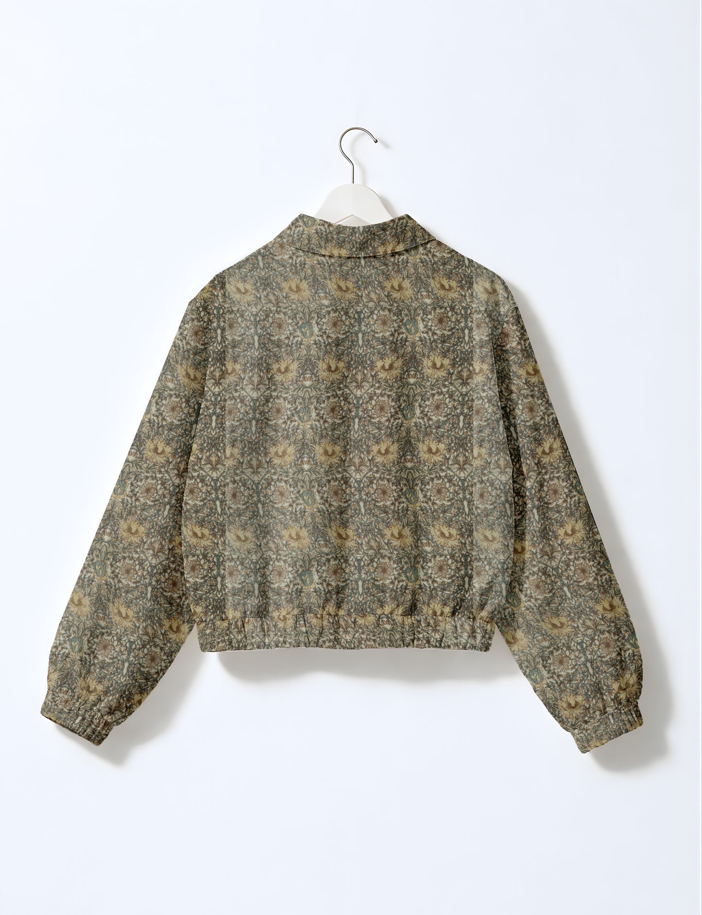Yellow bomber jacket with micro diamond and floral pattern, elastic cuffs and waistband, shown from back on hanger
