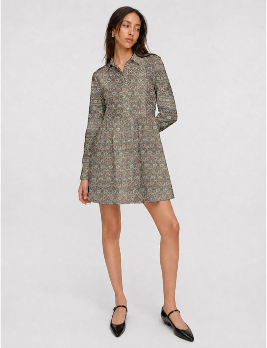 Short shirt dress with a relaxed A-line silhouette, point collar, partial button placket, gathered waist, side pockets, and full-length cuffed sleeves.